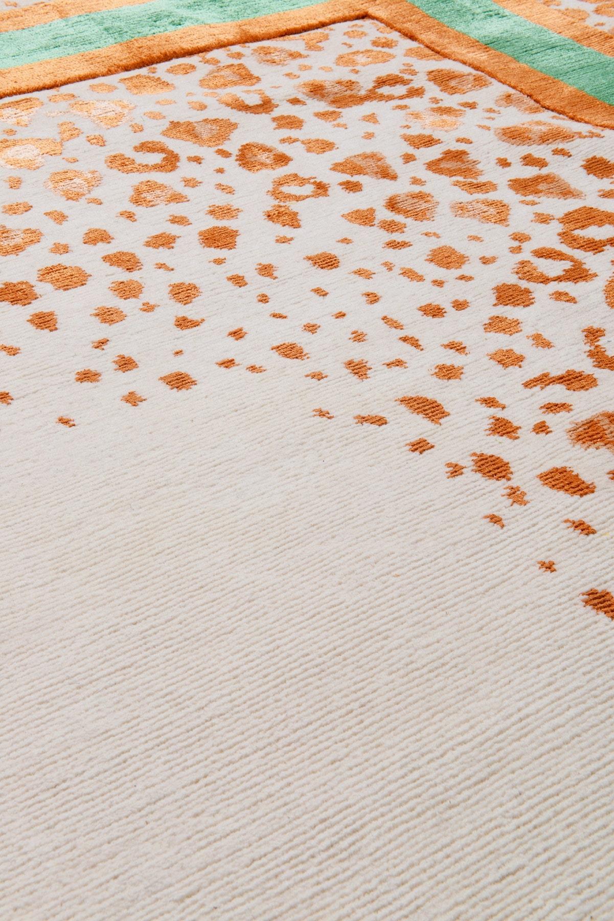 In striking green and orange hues, Panthera features a bricolage of delicate silk animal prints, which freckle over the woollen base. With a nod to ancient mythology, this multifaceted design incites intrigue and a sense of tamed revelry.
.  