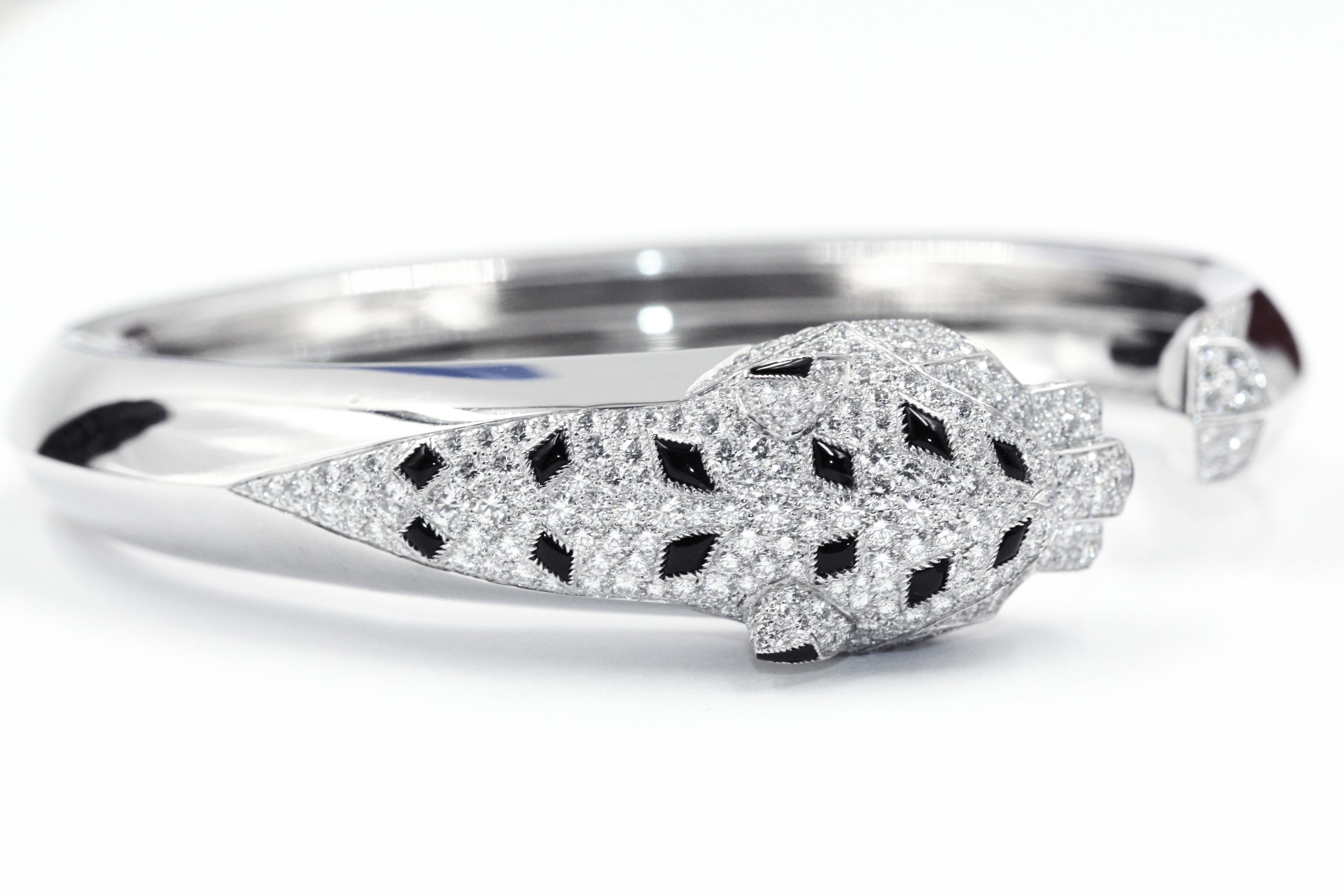 Panthère de Cartier Bracelet, 18 Karat White Gold, Diamonds, Emeralds, Onyx In Good Condition For Sale In New York, NY