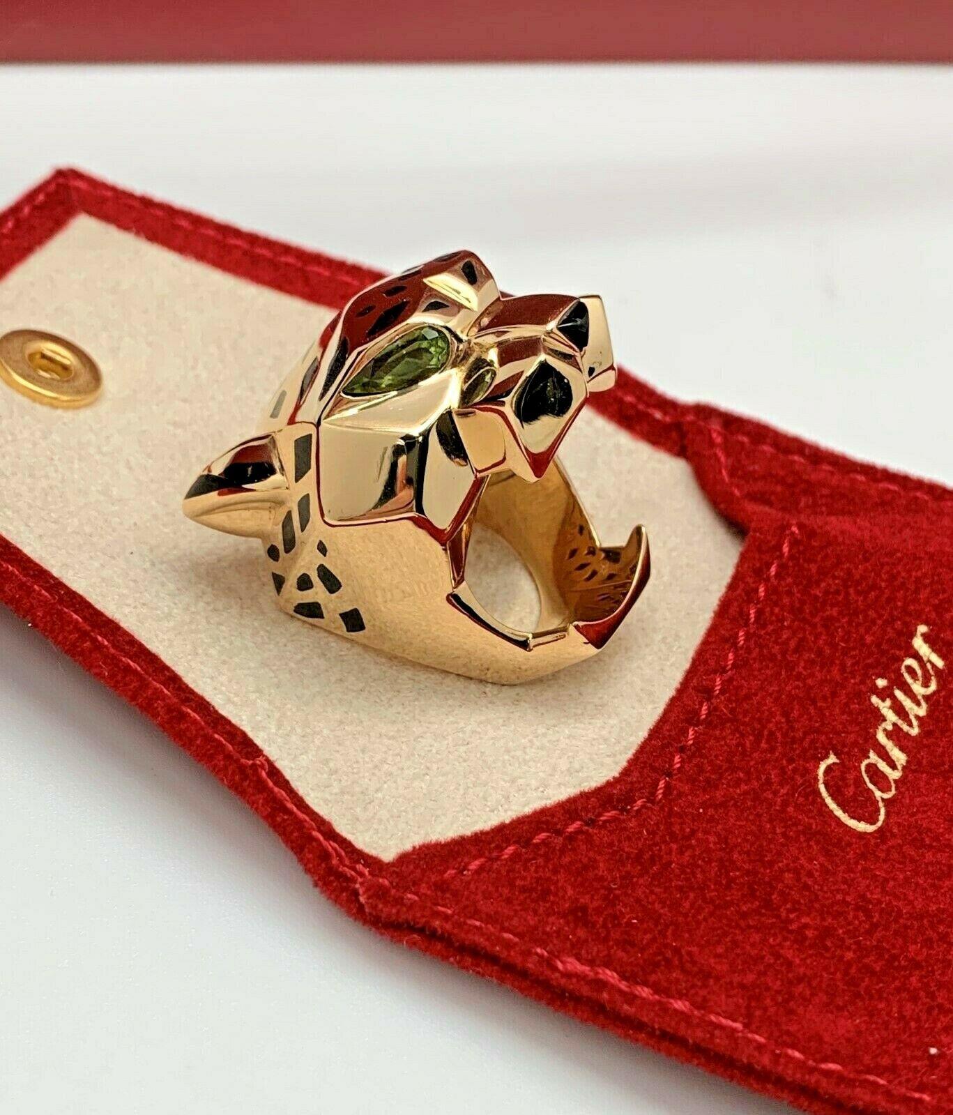 ITEM'S DESCRIPTION:

This exquisite Panthère de Cartier ring features a chic and fierce openwork panther design crafted in 18k yellow gold and accented with peridot eyes and a black onyx nose. Made in France circa 2010s. This beautiful ring has just