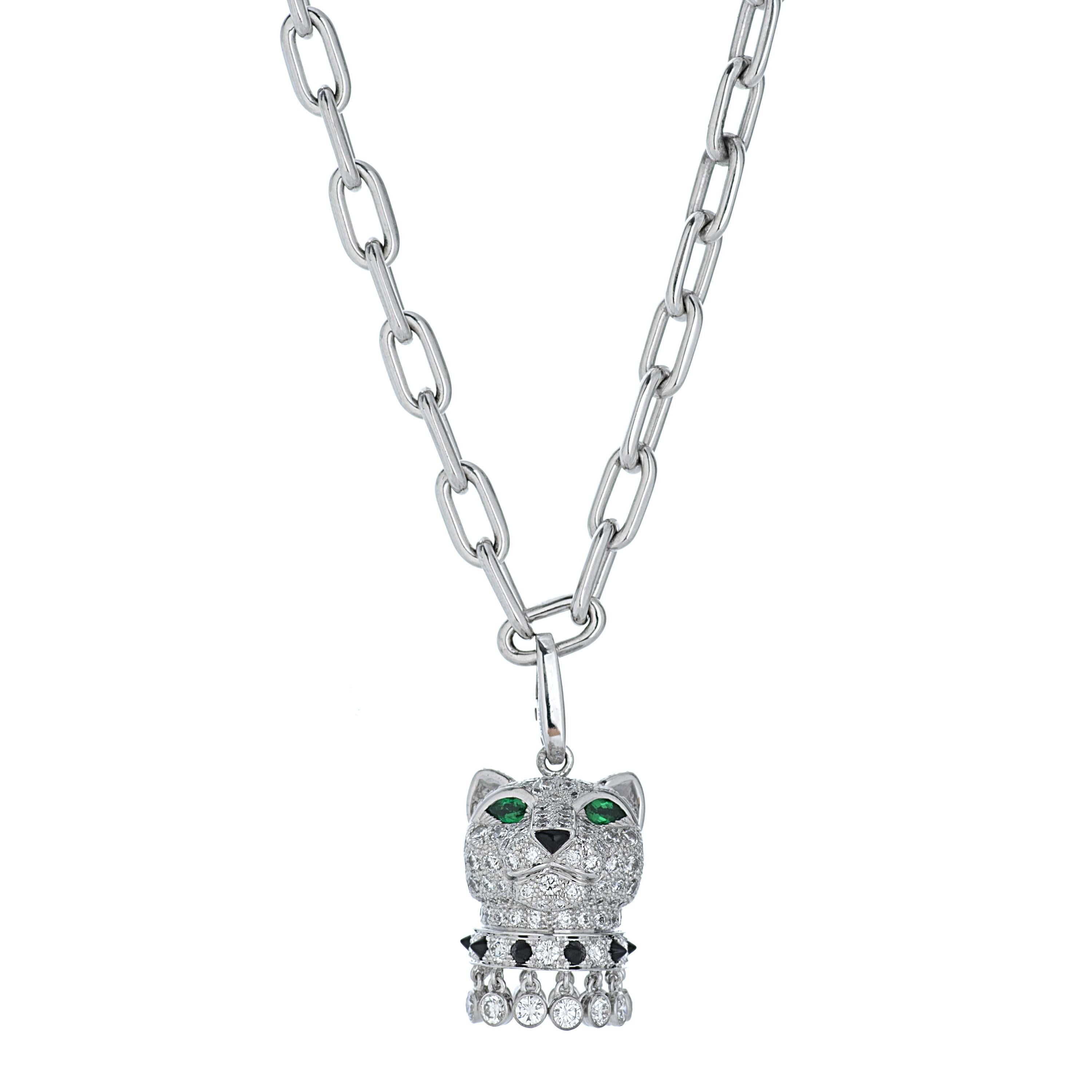 This Panthere De Cartier panther head pendant necklace features approximately 5.00 carats of round brilliant cut diamonds with F color and VVS-VS clarity.  The diamonds are accented by two emerald eyes as well as an onyx nose and studded collar. 
