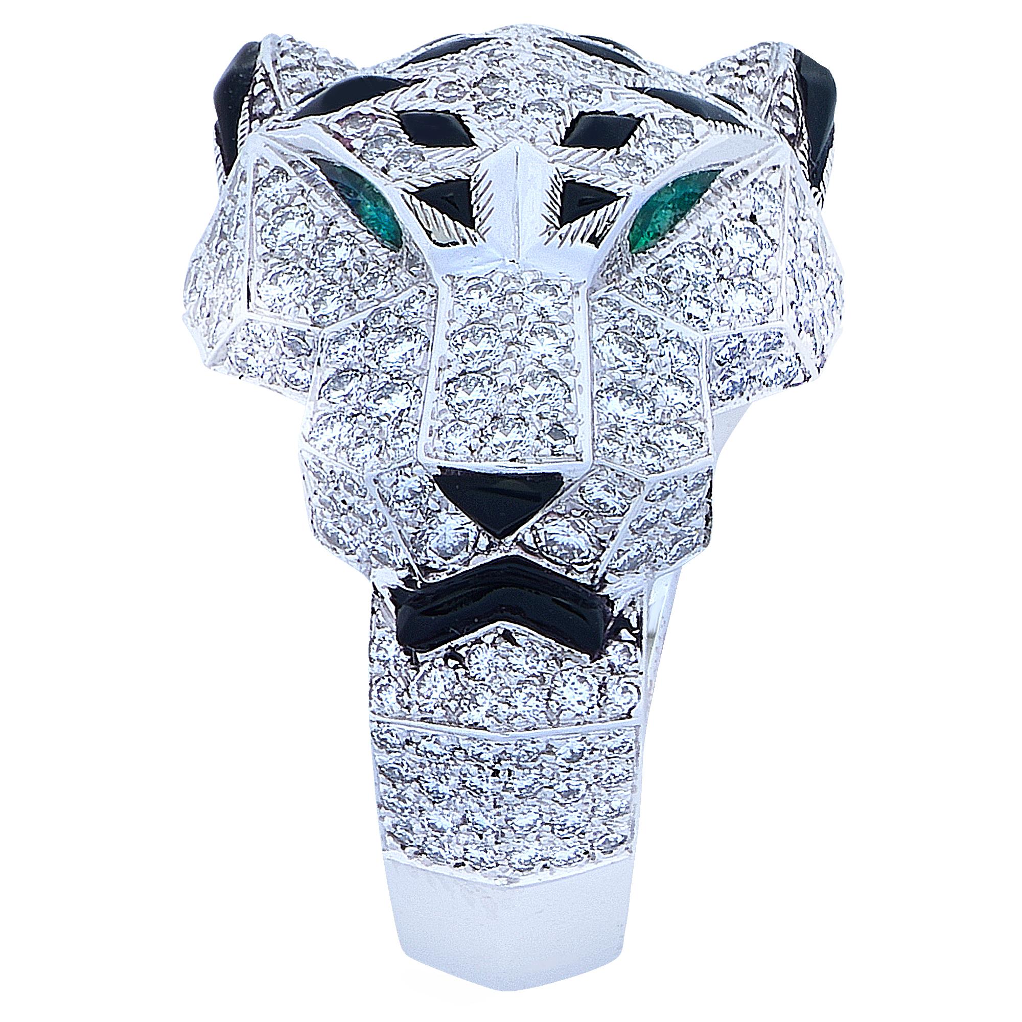 Stunning Panthere de Cartier ring, crafted in 18 karat white gold, encrusted with 365 diamonds weighing 2.55 carats total weight, with emerald eyes and an onyx nose and accents. The ring, which features Cartier’s iconic panther, is a European size