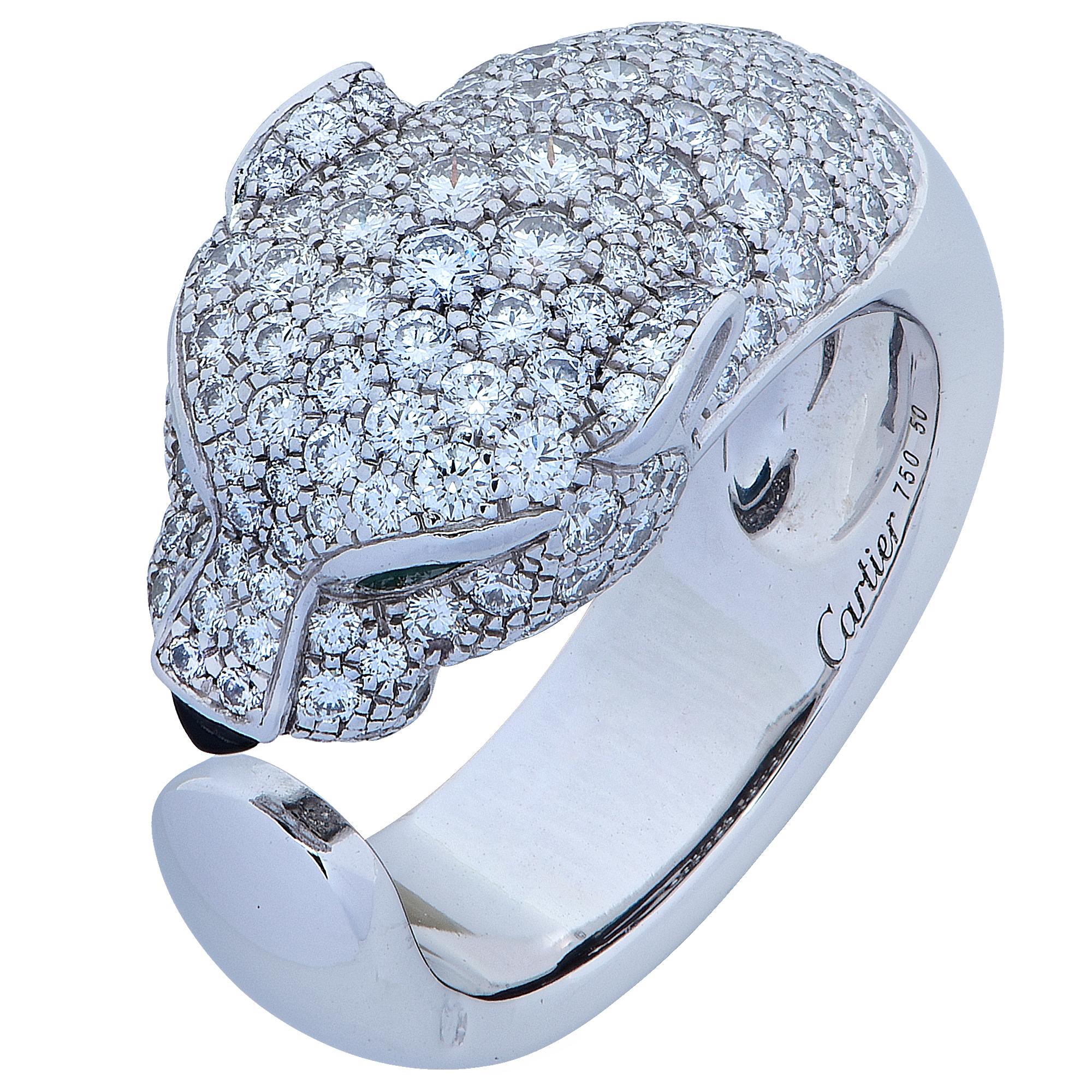 Stunning Panthere de Cartier ring, crafted in 18 karat white gold, encrusted with 137 diamonds weighing 1.15 carats total weight, with emerald eyes and an onyx nose. The ring, which features Cartier’s iconic panther, is a European size 50, which is