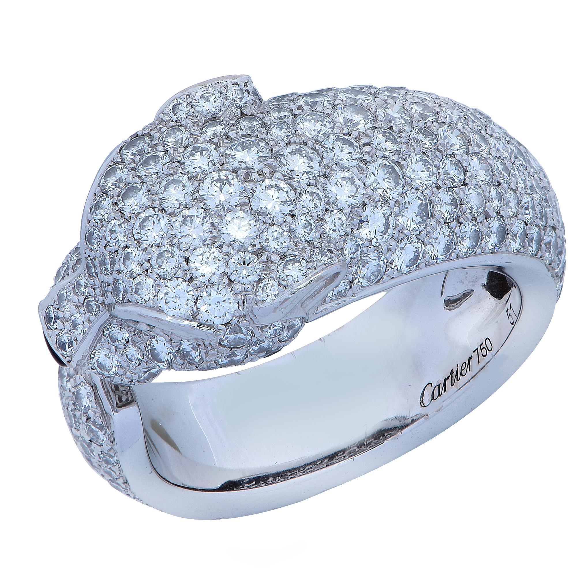 Stunning Panthere de Cartier diamond ring, crafted in 18 karat white gold, encrusted with 285 diamonds weighing 2.39 carats total weight, with emerald eyes and an onyx nose. The ring, which features Cartier’s iconic panther, is a European size 51,
