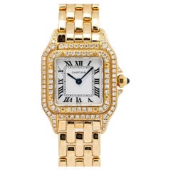 Montre femme Panthère de Cartier, double face diamantée, vintage, or jaune 18 carats