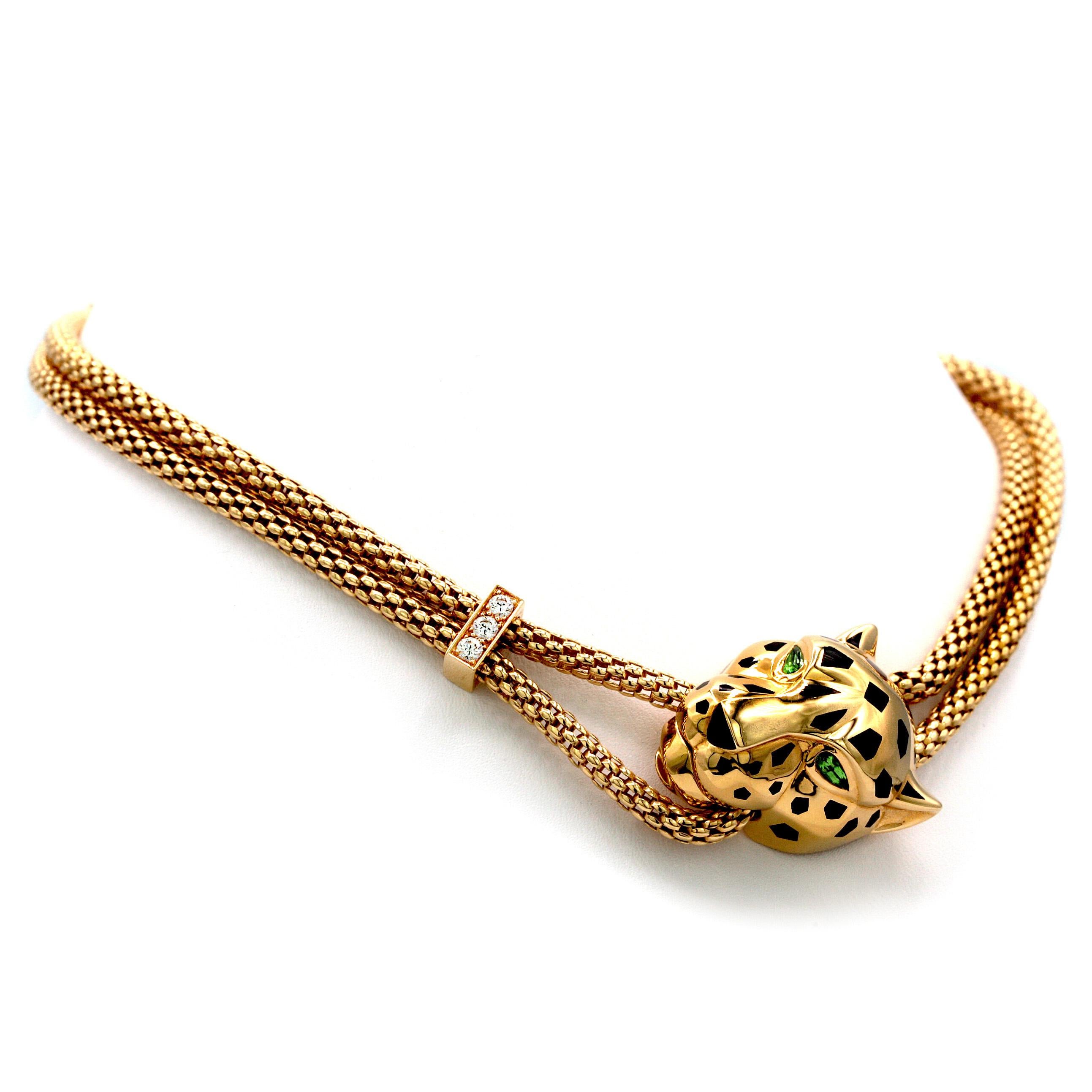 The panther, the symbolic animal of Cartier, made its first appearance in the Maison's collections in 1914.

This Necklace is made of 18K yellow gold, black lacquer, set with 3 brilliant-cut diamonds totaling 0.16 carat. Tsavorite garnet,