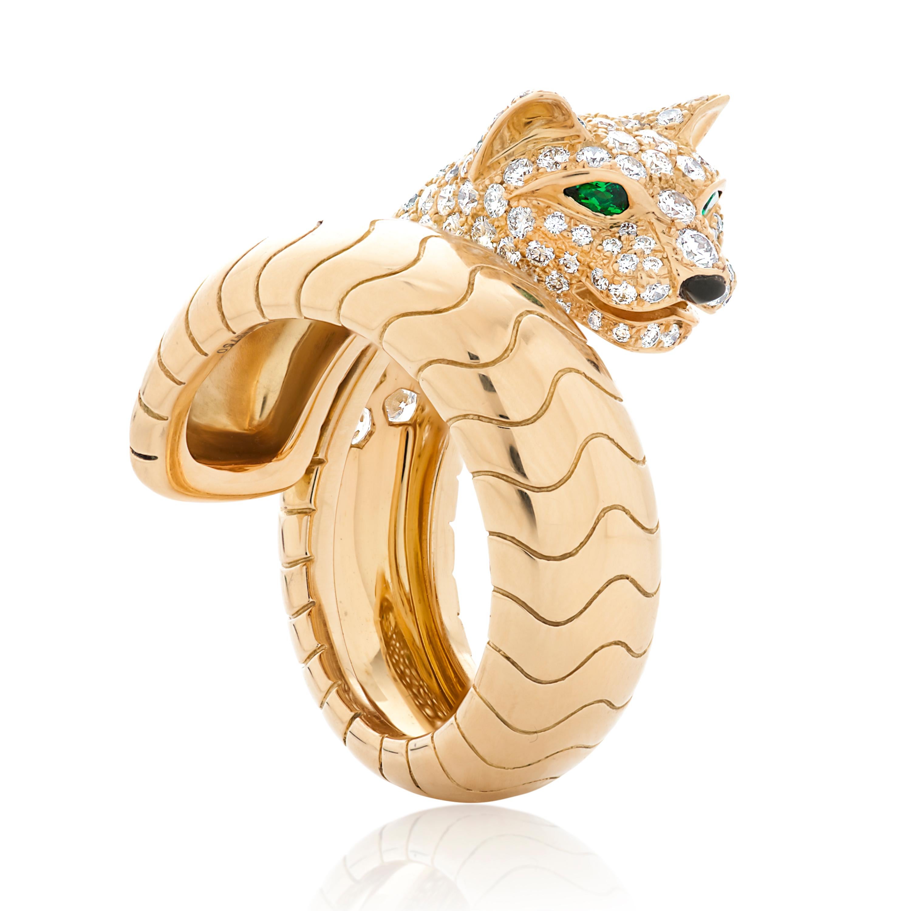 Panthere De Cartier diamond panther head bypass ring set in 18k yellow gold.  

This ring features approximately 2.00 carats of pave set round brilliant cut diamonds with F-G color and VS clarity, as well as emerald and onyx accents. 

The total