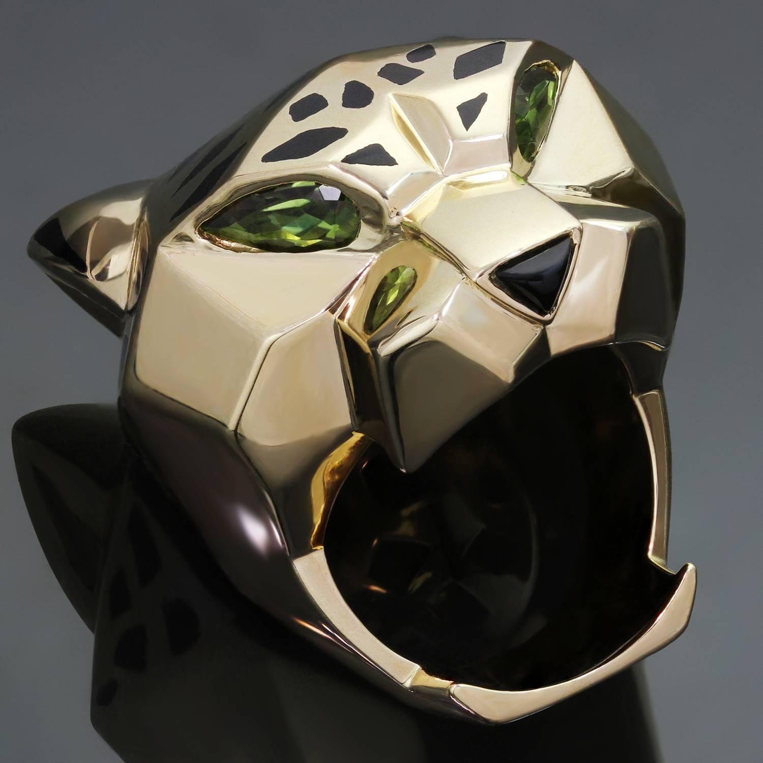 This gorgeous Panthère de Cartier ring features a chic and fierce panther design crafted in 18k yellow gold with black lacquer spots, faceted peridot eyes and a black onyx nose. Made in France circa 2010s. Measurements: 1.22