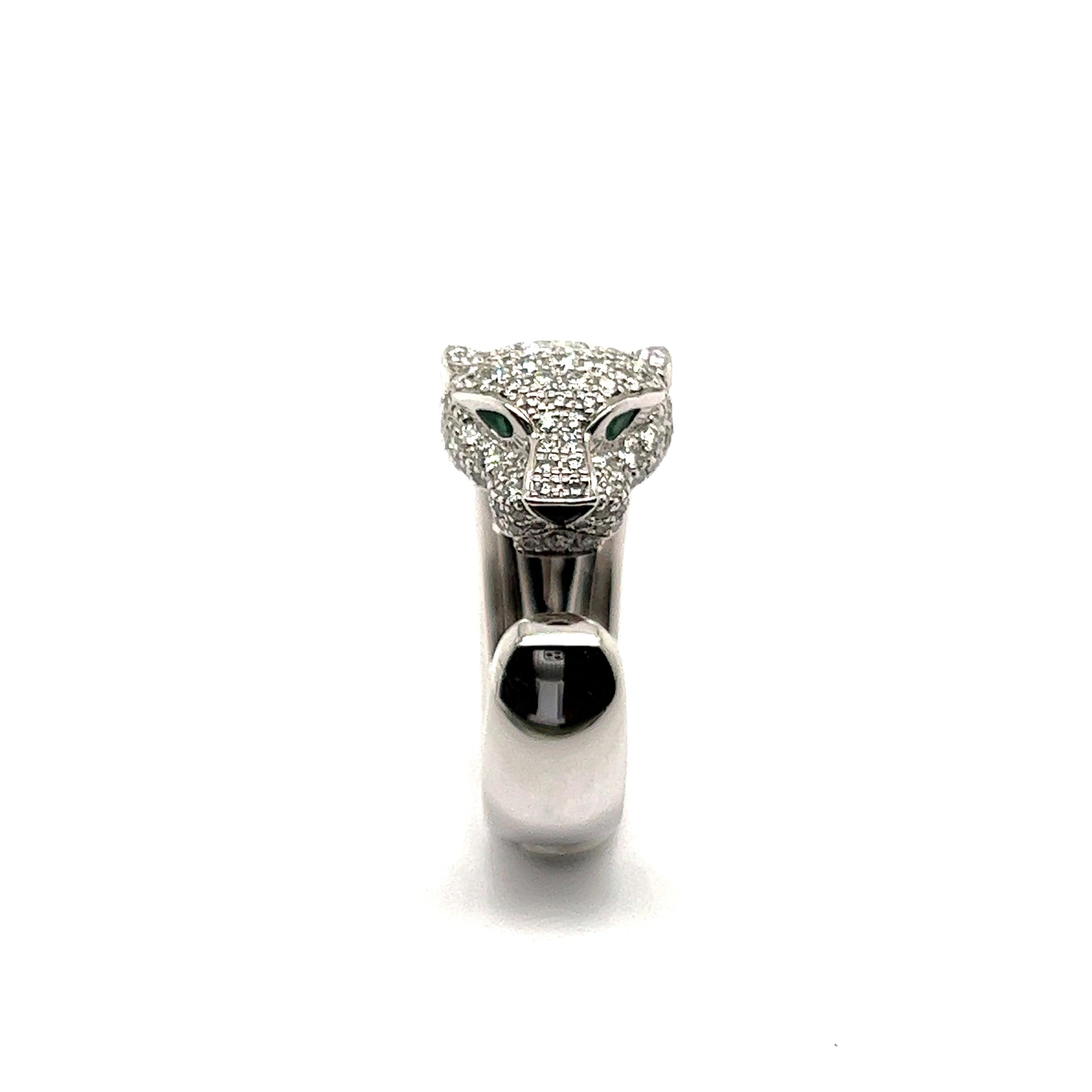 Panthère de Cartier ring, white gold 750/1000, onyx, set with 2 emeralds and 137 brilliant-cut diamonds totalling 1.15 carats. 

Comes in original box but no papers. 

Size: 51 EU / 5.25 US
Numberd: 37148C
Maker's mark: Cartier
Assay mark: 750
