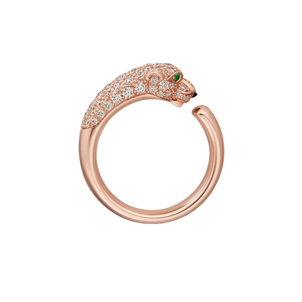 Introducing the Panthère de Cartier ring in 18K Rose Gold. The ring is set with 2 emeralds and 72 brilliant-cut diamonds totaling 0.68 carats. Onyx is set on the nose of the Panthère. This captivating piece features the iconic panther motif, a