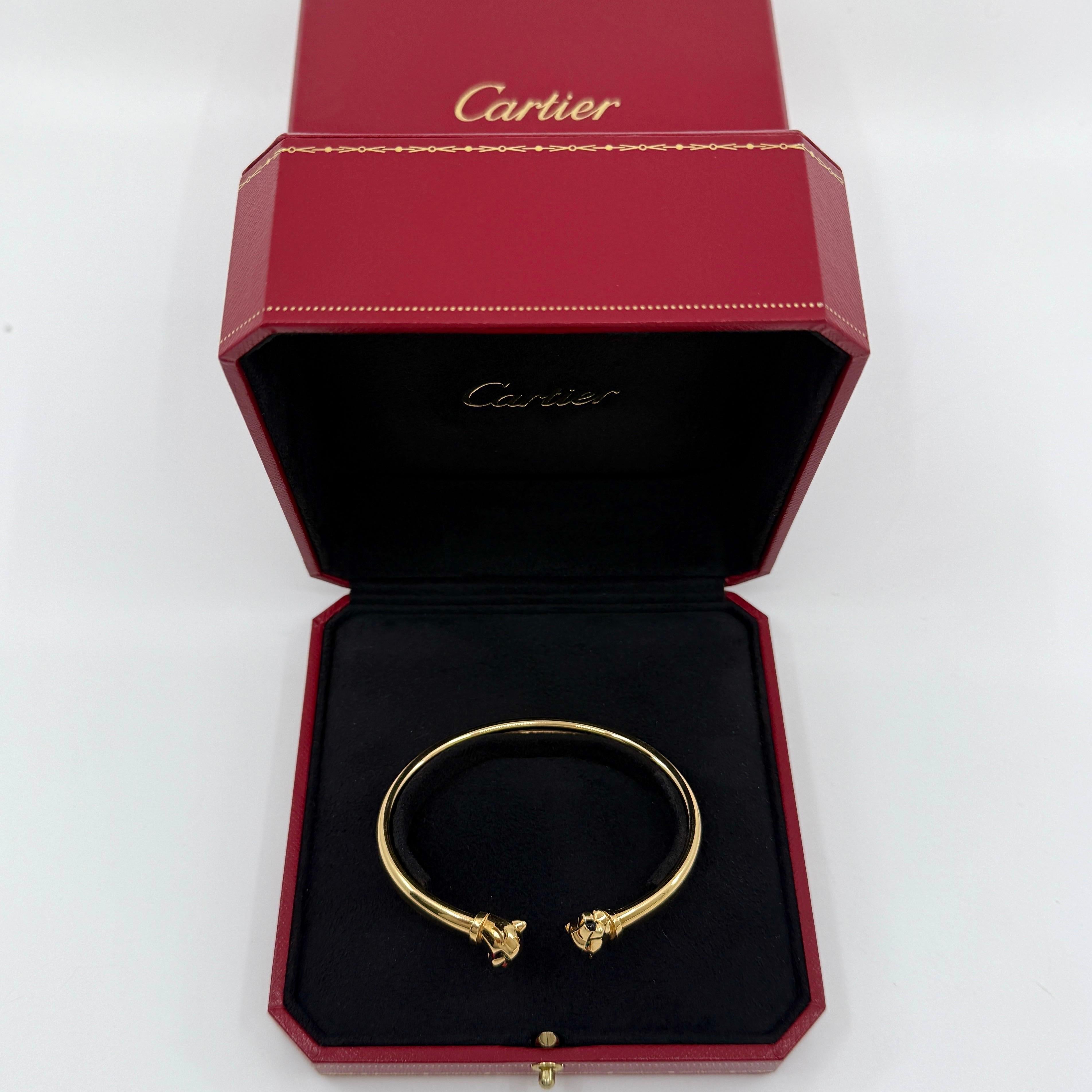 Rare Cartier 'Panthere De Cartier' Tsavorite Garnet And Onyx 18k Yellow Gold Cuff Bangle Bracelet.

Rare and sought after bracelet from Cartier, featuring a classic Cartier Panther motif. This beautifully designed bracelet has two perfectly formed
