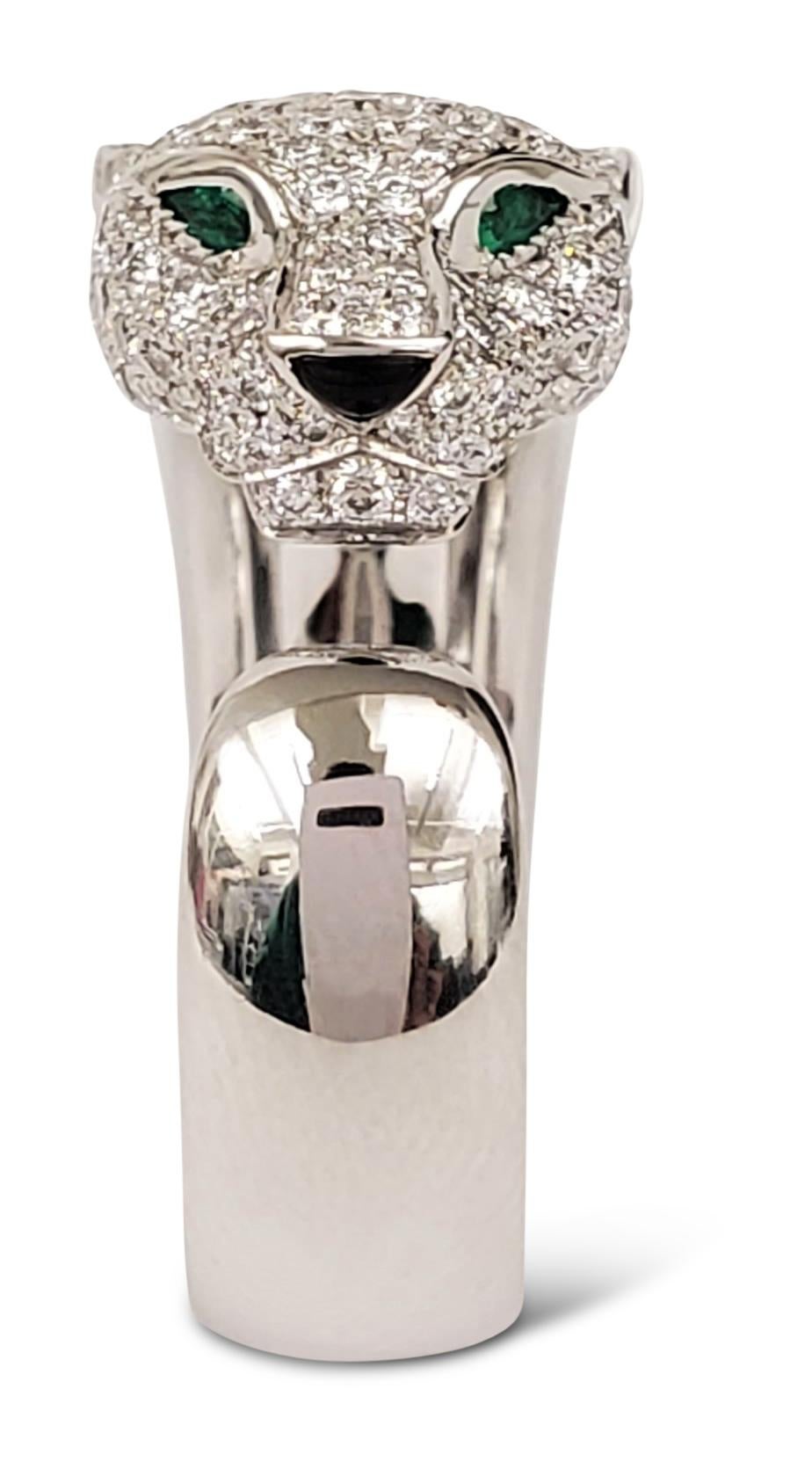 Authentic Panthère de Cartier ring crafted in 18 karat white gold and set with approximately 1.35 carats of round brilliant cut diamonds (E-F color, VS clarity) throughout the head and of mane of the panther. The panther head is completed with