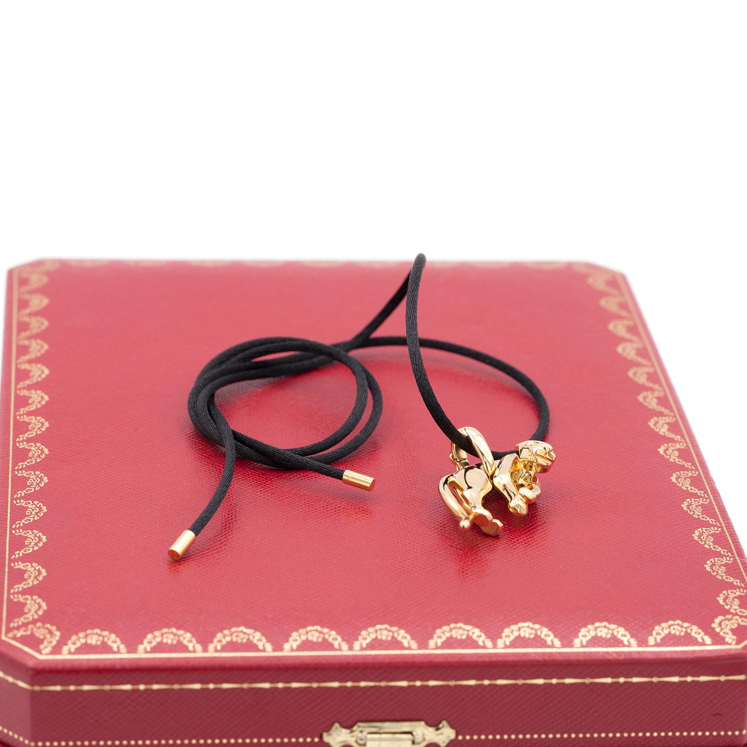 The iconic Cartier Panther necklace
18 karat yellow gold, on a black silk rope.
signed Cartier, dated 1991 and numbered.
with original Cartier box
Every piece will arrive in special packaging. 