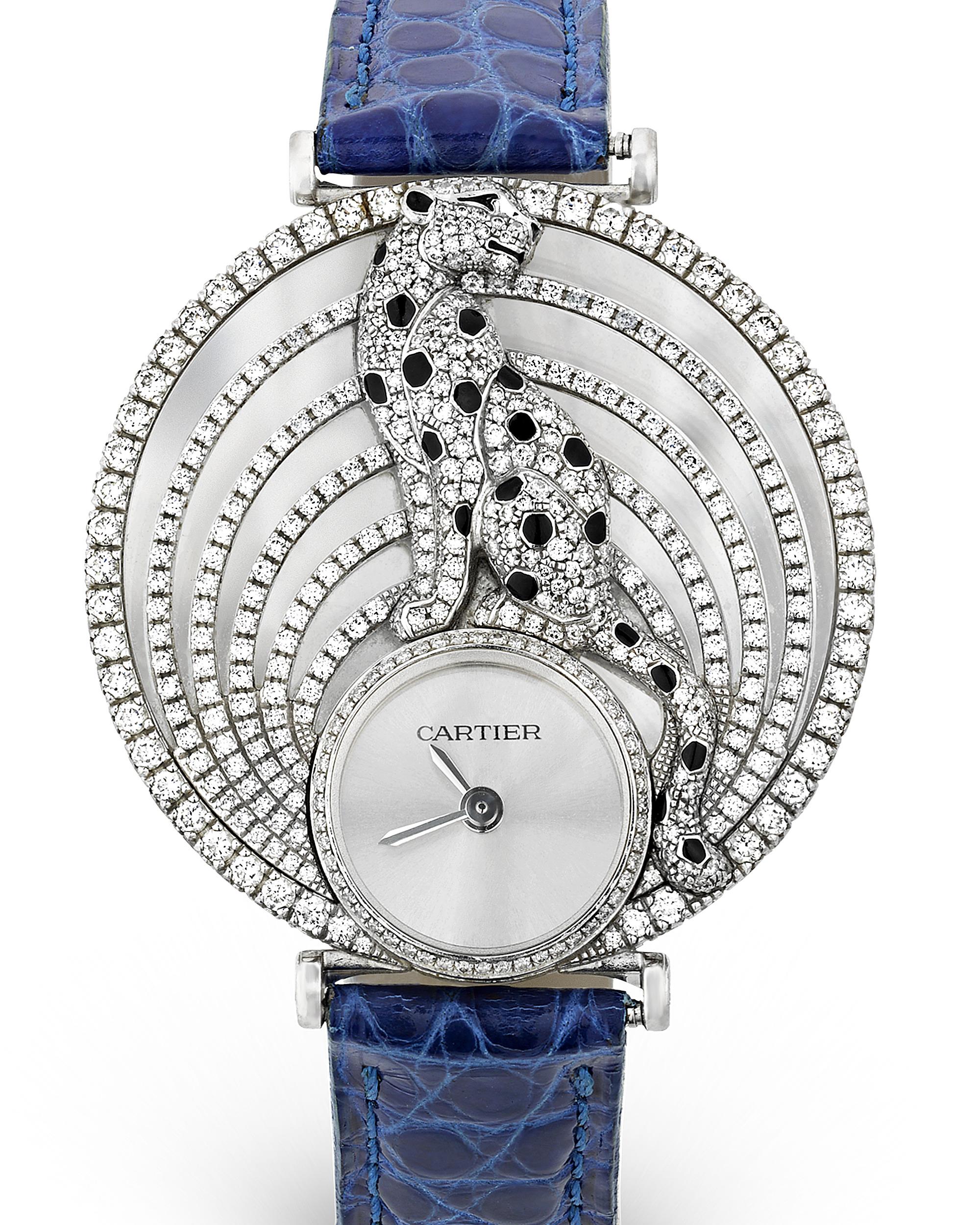 Cartier's signature panthére perches regally atop the face of this wristwatch. Surrounded by six bands of opulent diamonds, the panthére's lacquered spots are visually striking in contrast to the brilliant white diamonds and 18K white gold face.