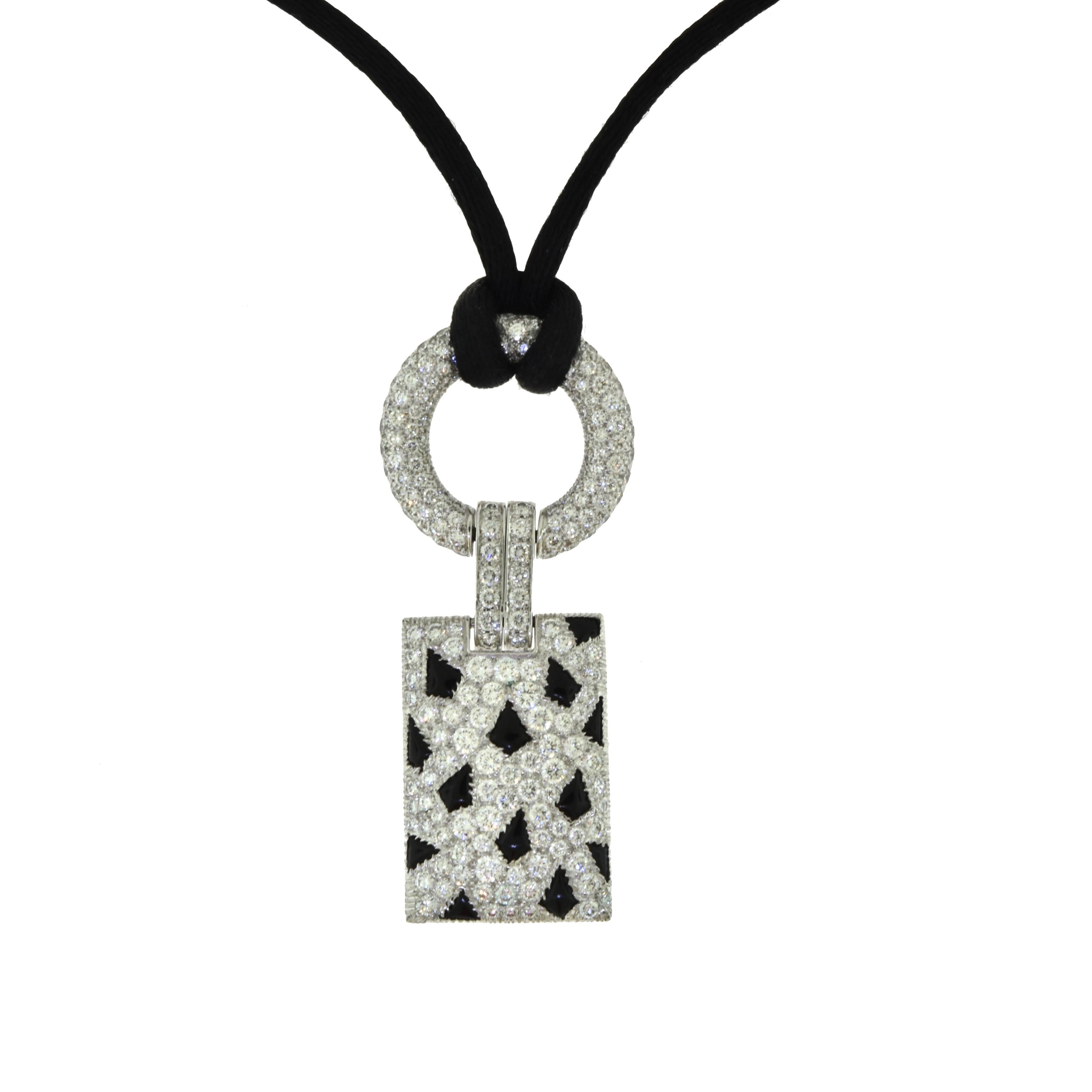 Set in 18k White Gold, this beautiful Cartier necklace from the Panthere de Cartier collection features round brilliant diamonds with spotted black onyx for that animalistic elegant look.

Total Carat Weight: 2.85 ct
Diamond Color: DEF 
Diamond