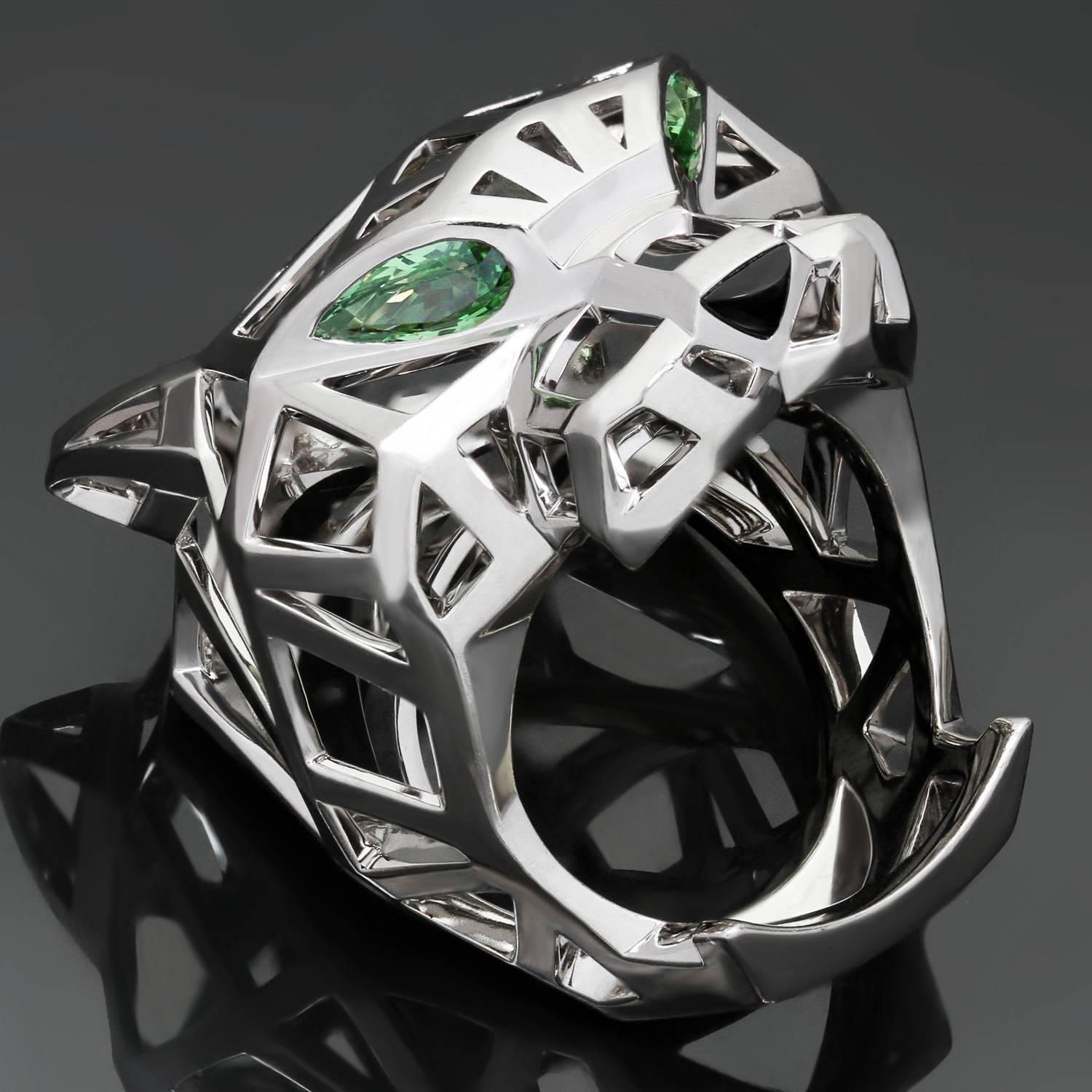 This exquisite Panthère de Cartier ring features a chic and fierce openwork panther design crafted in 18k white gold and accented with tsavorite garnet eyes and a black onyx nose. Made in France circa 2010s. Measurements: 1.06