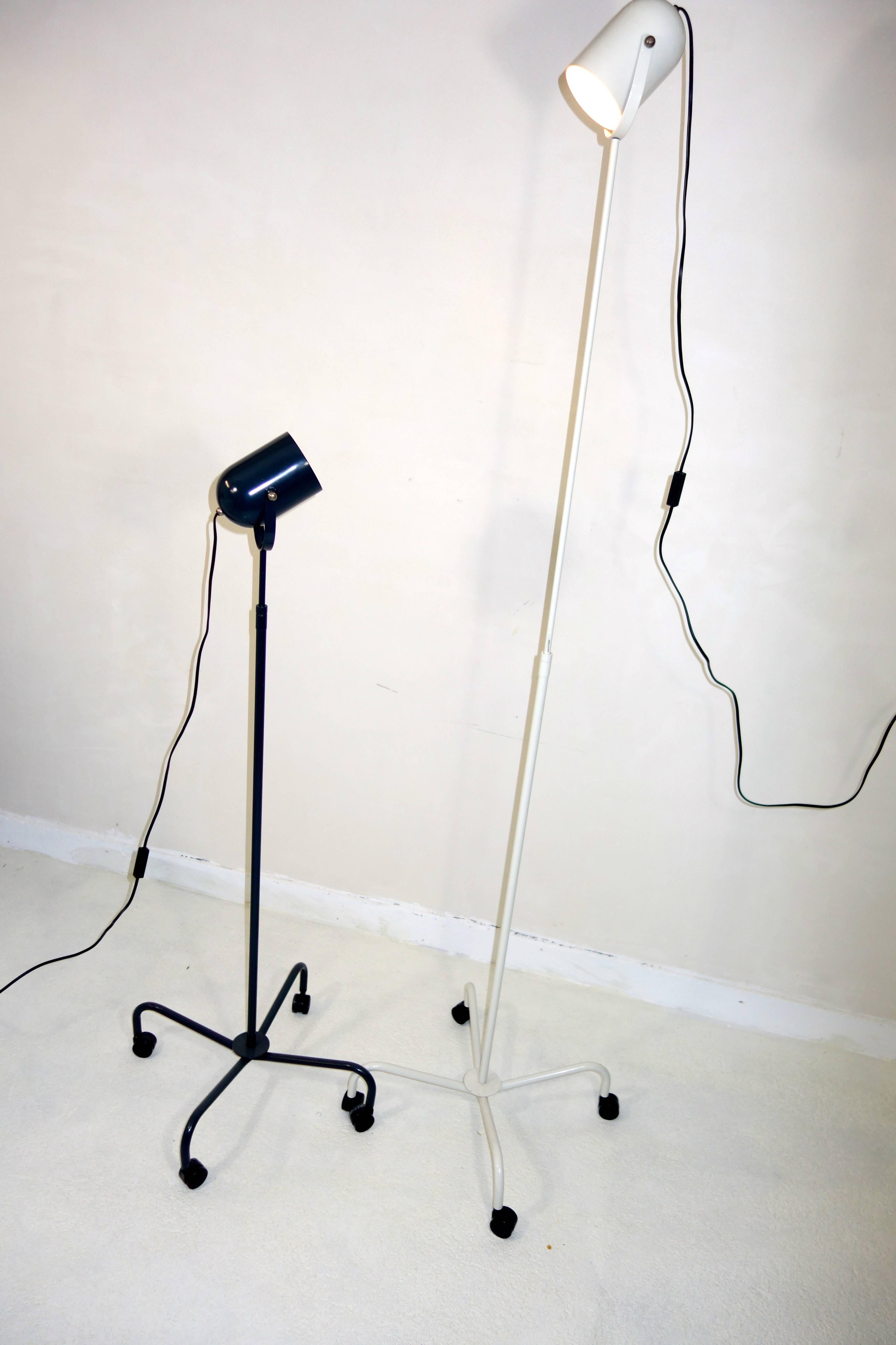 Pair of Postmodern Floor Lamps Panto Beam by Danish designer Verner Panton.
One black and one white Panto Beam, this pair of lamps was designed by Verner Panton in 1998. 
The lamps are very flexible, not only due to their wheels but also because the