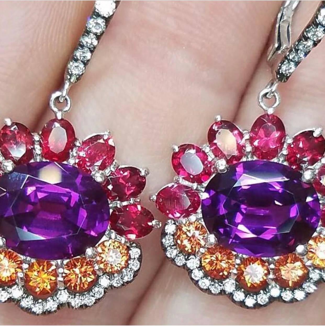 Bella Campbell's New 18 K White Gold Earrings with Magnificent Violet Garnet Center, Surrounded With Burmese Red Spinels and Orange Sapphires, Accented with Diamonds,With Their Wonderful sense of movement and their Joyous Colors, they are perfect