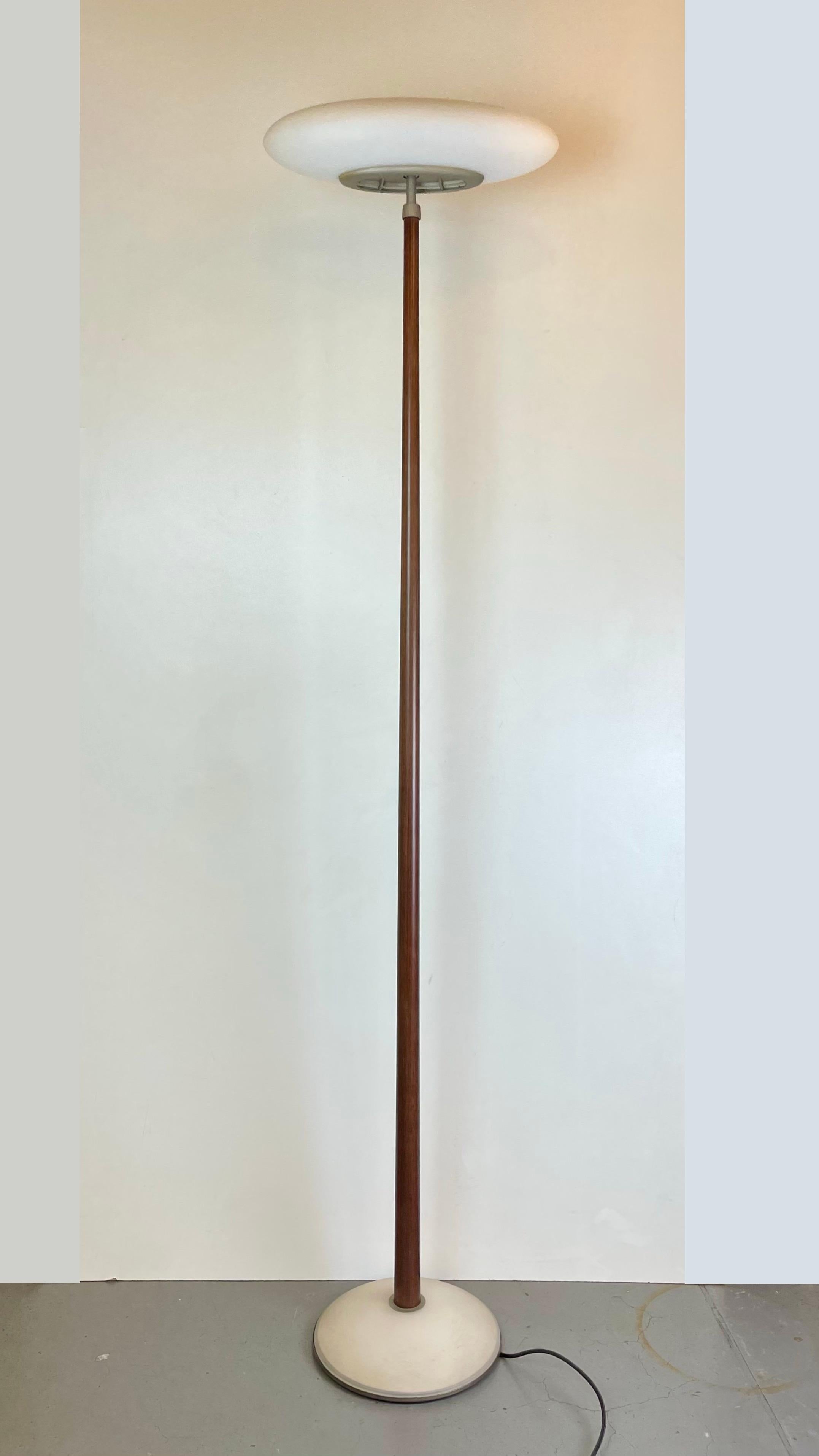 PAO, tall floor lamp made with a satin glass base, ebonized wood stem, and an opal glass oval-shaped diffuser that emits a beautiful, warm light, gently diffused through the white glass. Designed by Matteo Thun for Arteluce in the 1990’s.
-
PAO,