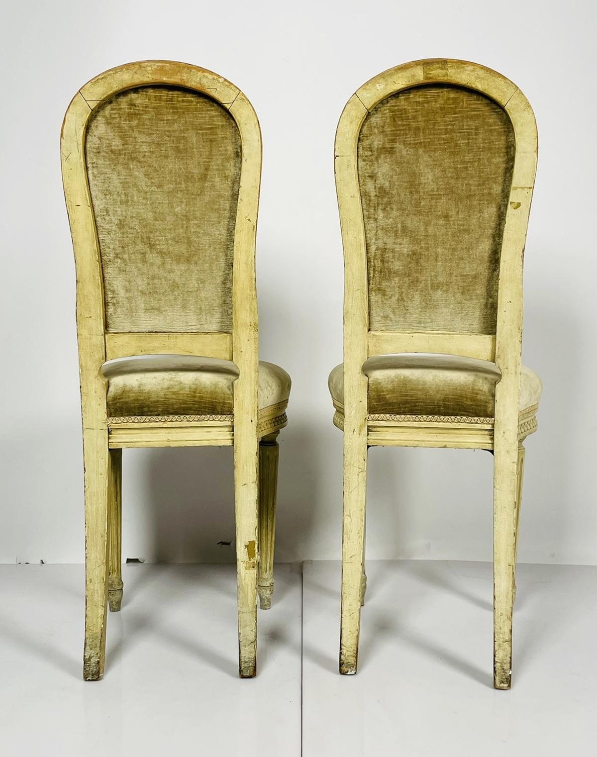 Beautiful pair of side chairs in the Louis XVI style, the chairs are upholstered in a velvet fabric and a white wash finish.
The chairs date from the early 1900s and are in good vintage condition.

Measurements:
38.75 inches high x 15.50 inches