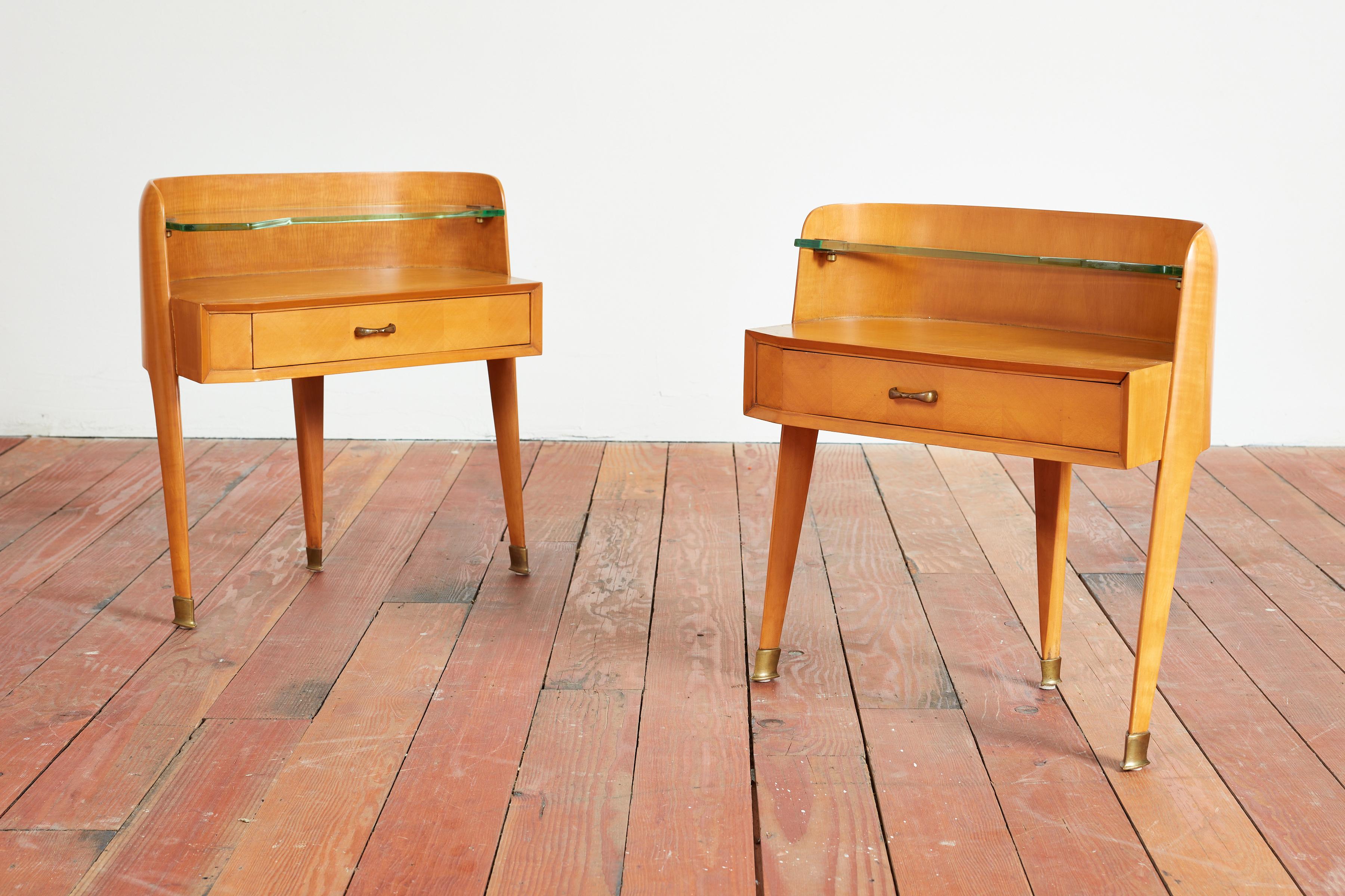 Fantastic pair of Paolo Buffa Nightstands - Italy, 1940s
Curved shape with angular legs with brass hardware and handles 
Original curved glass shelf with single drawer 
Newly refinished.