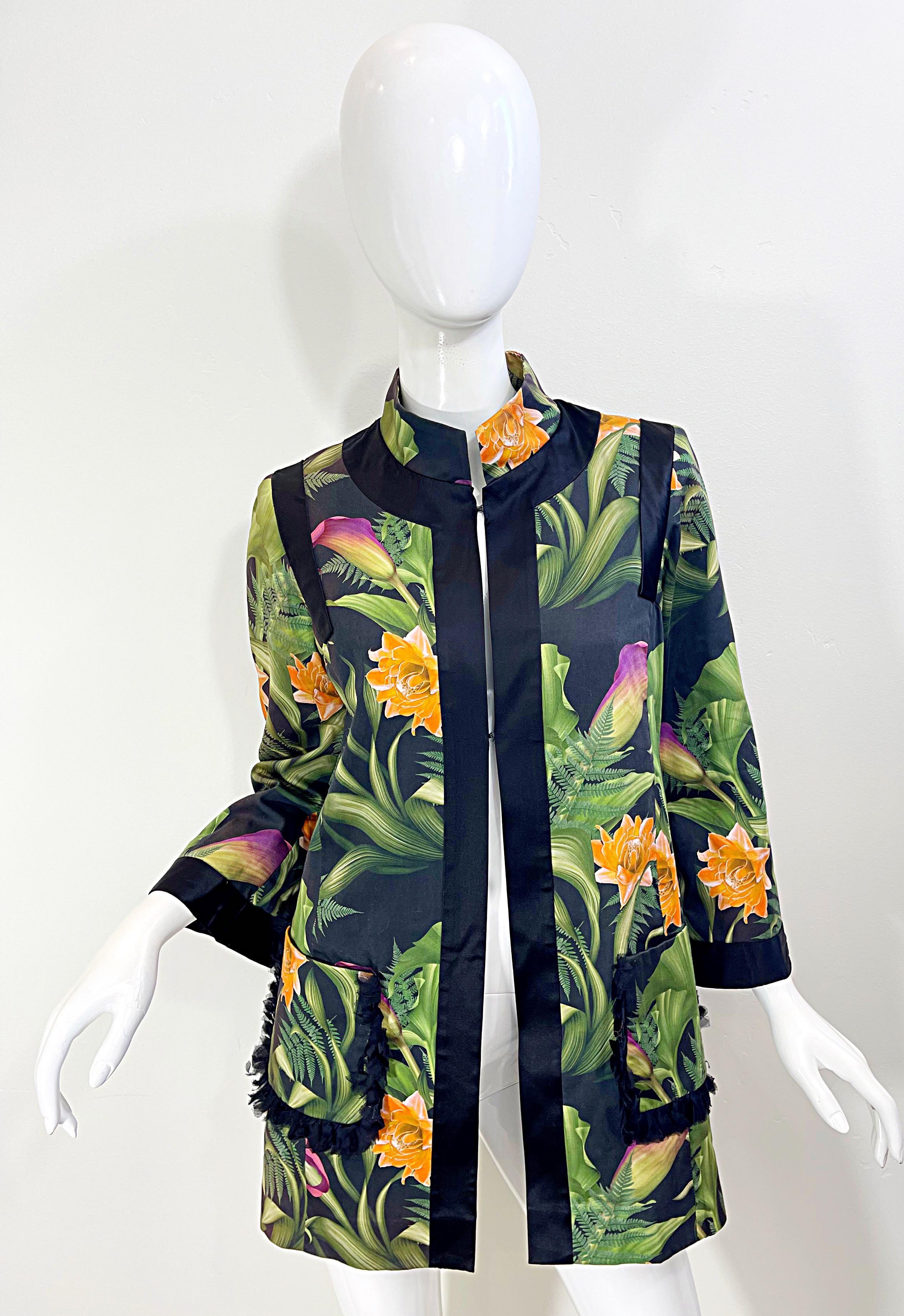 Beautiful 1990s PAOLA QUADRETTI Couture botanical garden printed silk jacket ! Vibrant colors of purple, fuchsia, orange, green and black. Black chiffon detail on each pocket. Hidden hook-and-eye closures ( two ) at neck and bust. Couture quality.