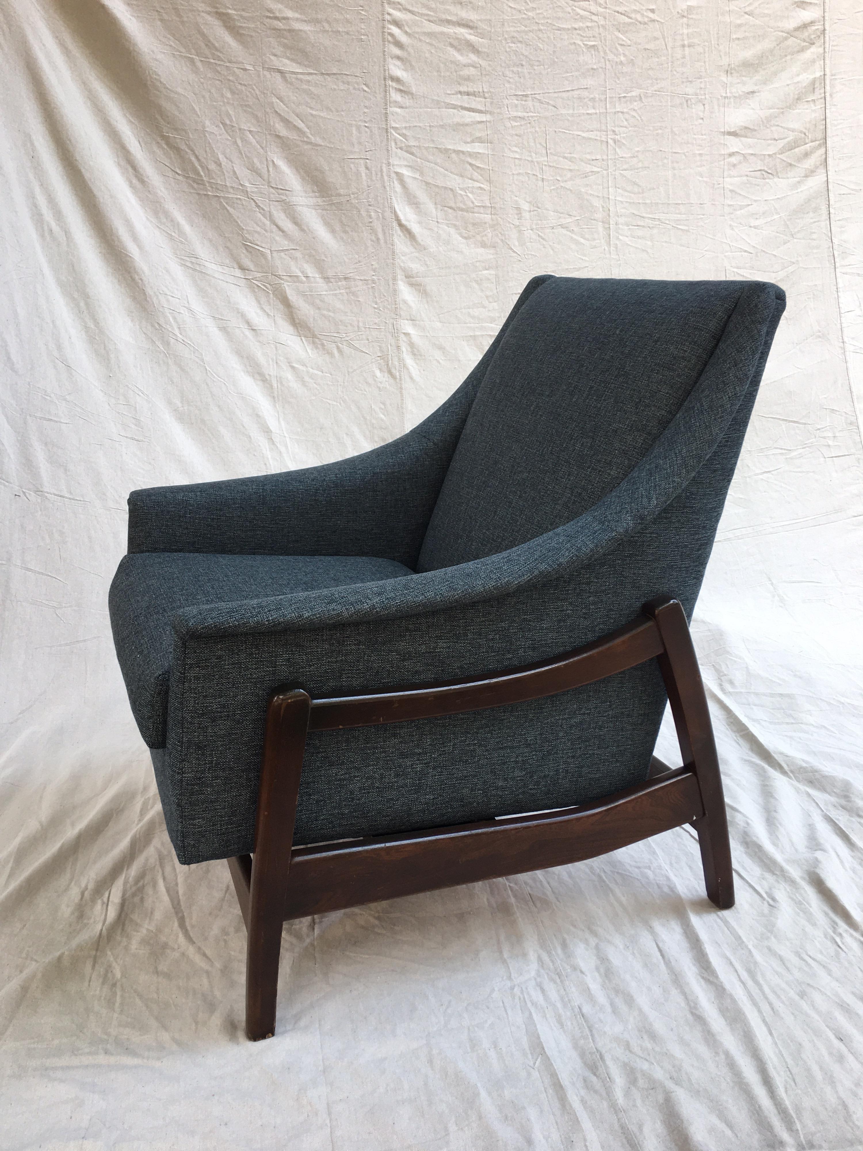 Rocking lounge chair all redone in a blue textured fabric. Surprisingly very comfy! Walnut frame refinished as well! Great scale, easy fit even in a tight space!