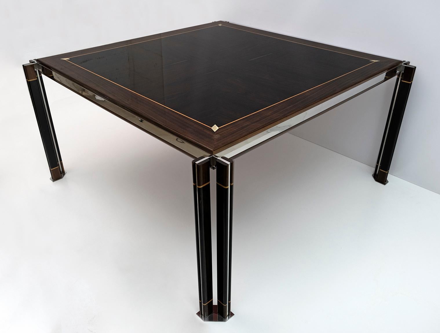 A large square Italian dining table designed by Paolo Barracchia. Featuring exquisite detailing including a thick brass band, double open legs and maple inlays. Manufactured by Roman Deco.