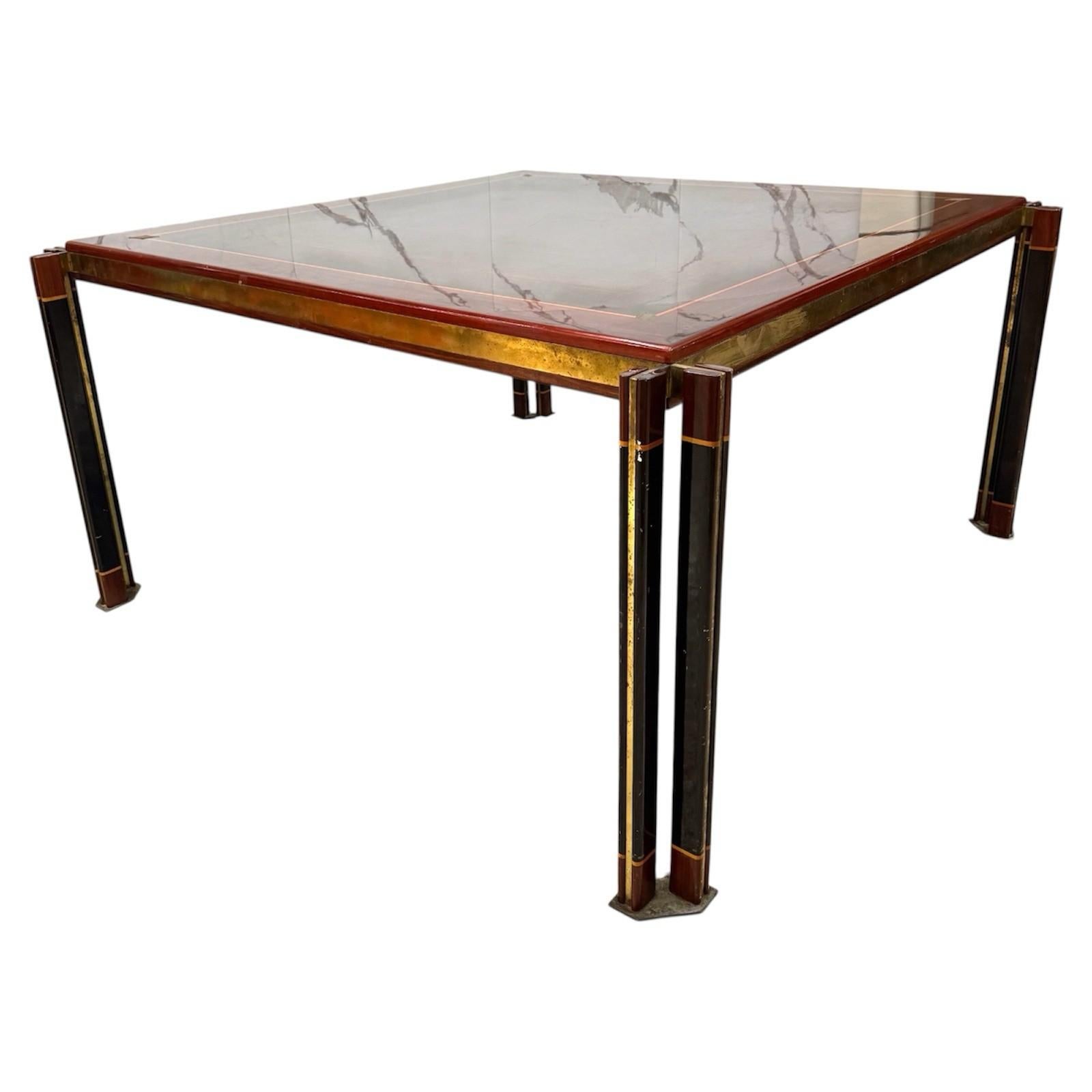 Paolo Barracchia for Roman Deco - Large Dining Table, 1970s

Important dining table of great scenic impact, designed by Paolo Barracchia for Roman Deco in the 1970s.

Made with a refined brushed brass frame covered in lacquered and inlaid wood, the