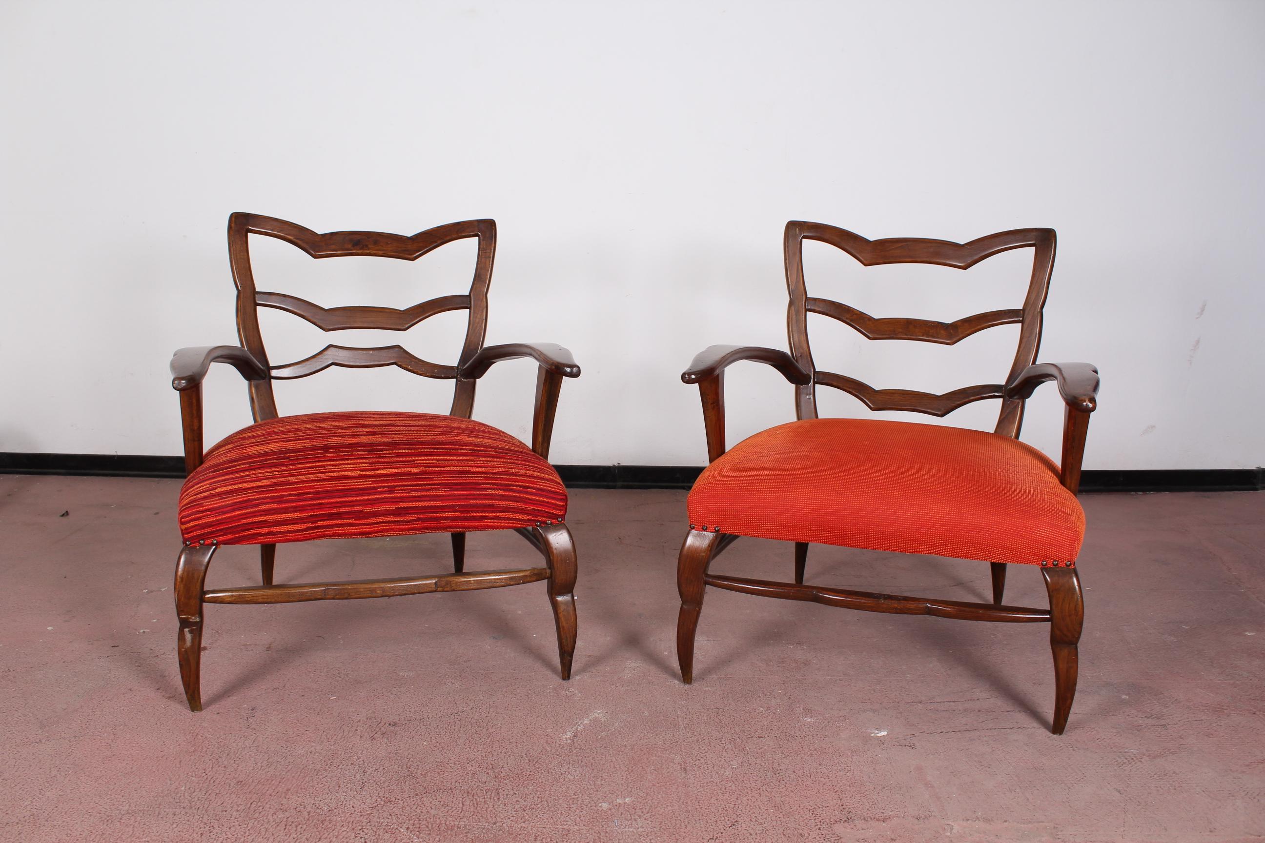 Pair of armchairs attributed to Paolo Buffa, Italy, circa 1940. Stylish original and particular armchairs with carved wooden arms, recently completely restored and reupholstered in Modern coordinated fabric.