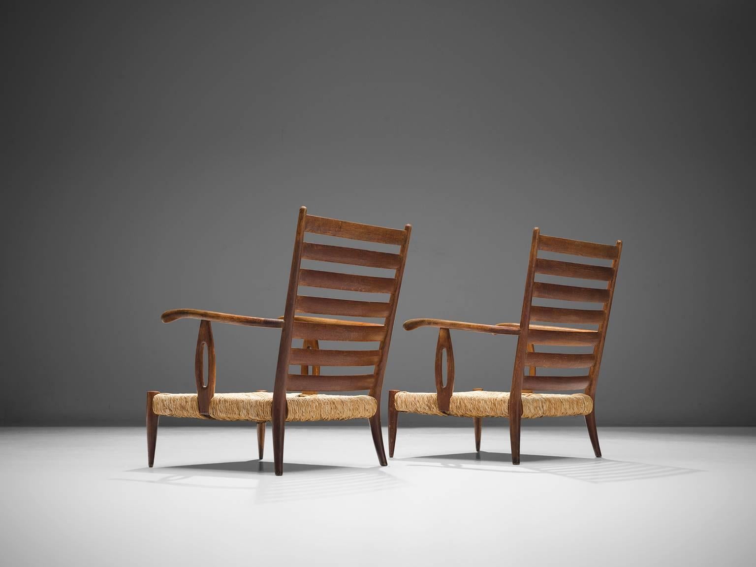 Paolo Buffa, pair of armchairs, walnut and wicker, Italy, 1950s.

This pair of wide, robust armchairs are made of wood and cane. The aesthetics of this set is natural and organic. The set features strong features that are quintessential for Buffa,