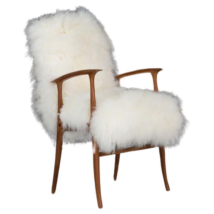 What a stunning and sleek pair of chairs by Paolo Buffa, which originated during the 1950s in Italy. These one of a kind chairs have a minimalist look to them with a Walnut frame and have been recently reupholstered in Tibetan Wool. Perfect for just