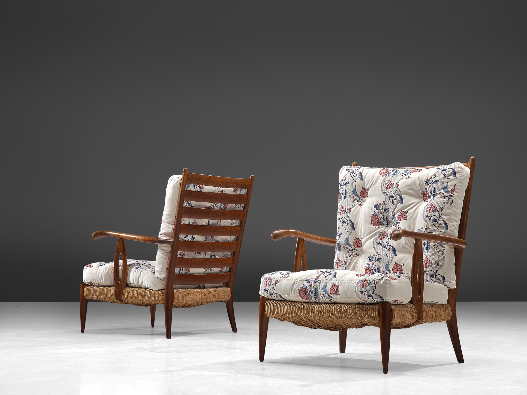 Paolo Buffa, pair of armchairs, walnut, wicker and fabric, Italy, 1950s.

This pair of wide, robust armchairs are made of wood and cane. The aesthetics of this set is natural and organic. The set features strong features that are quintessential