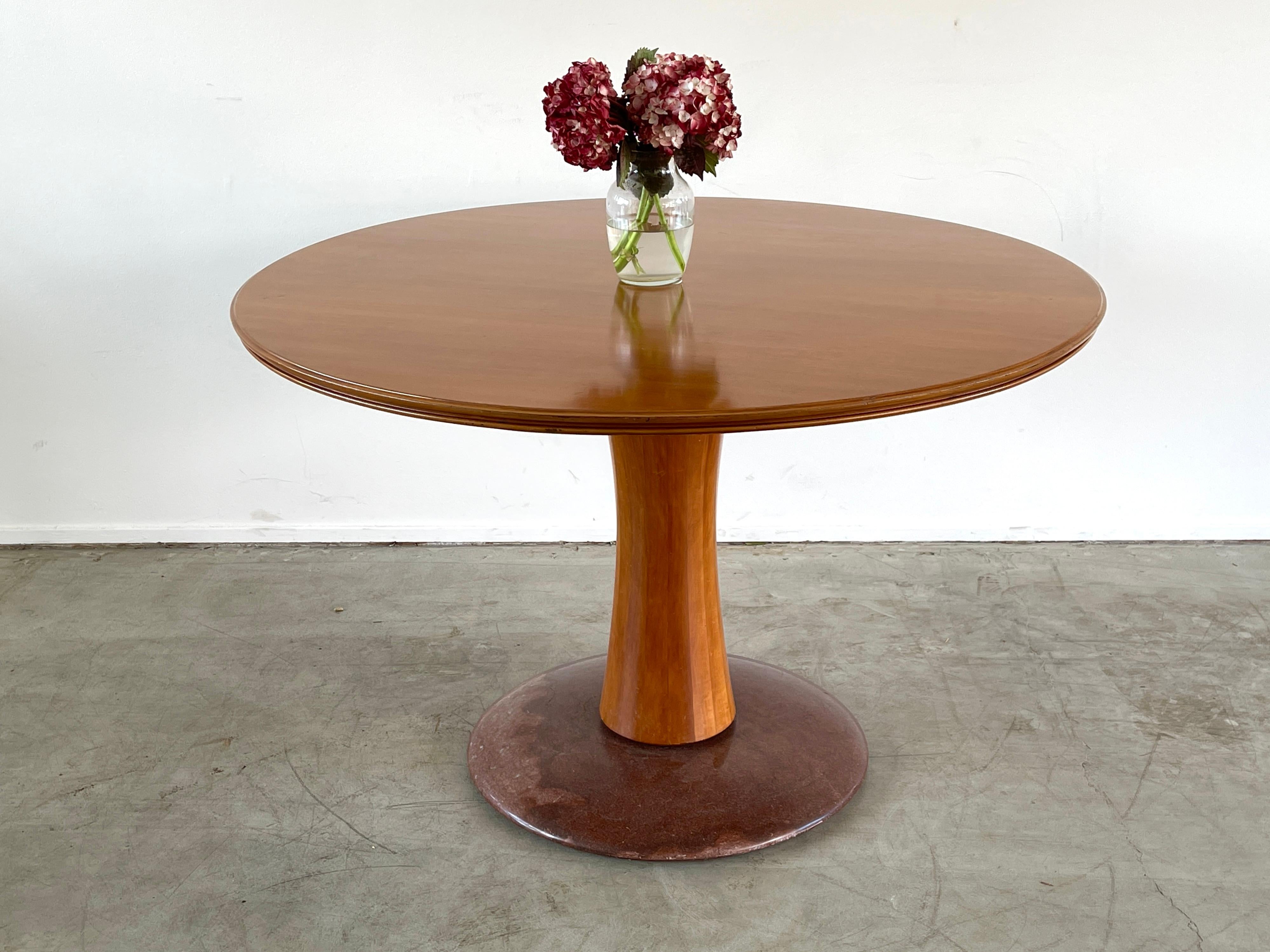 Beautiful center attributed to Paolo Buffa
Cherry wood top and faceted wood pedestal sitting on marble base.