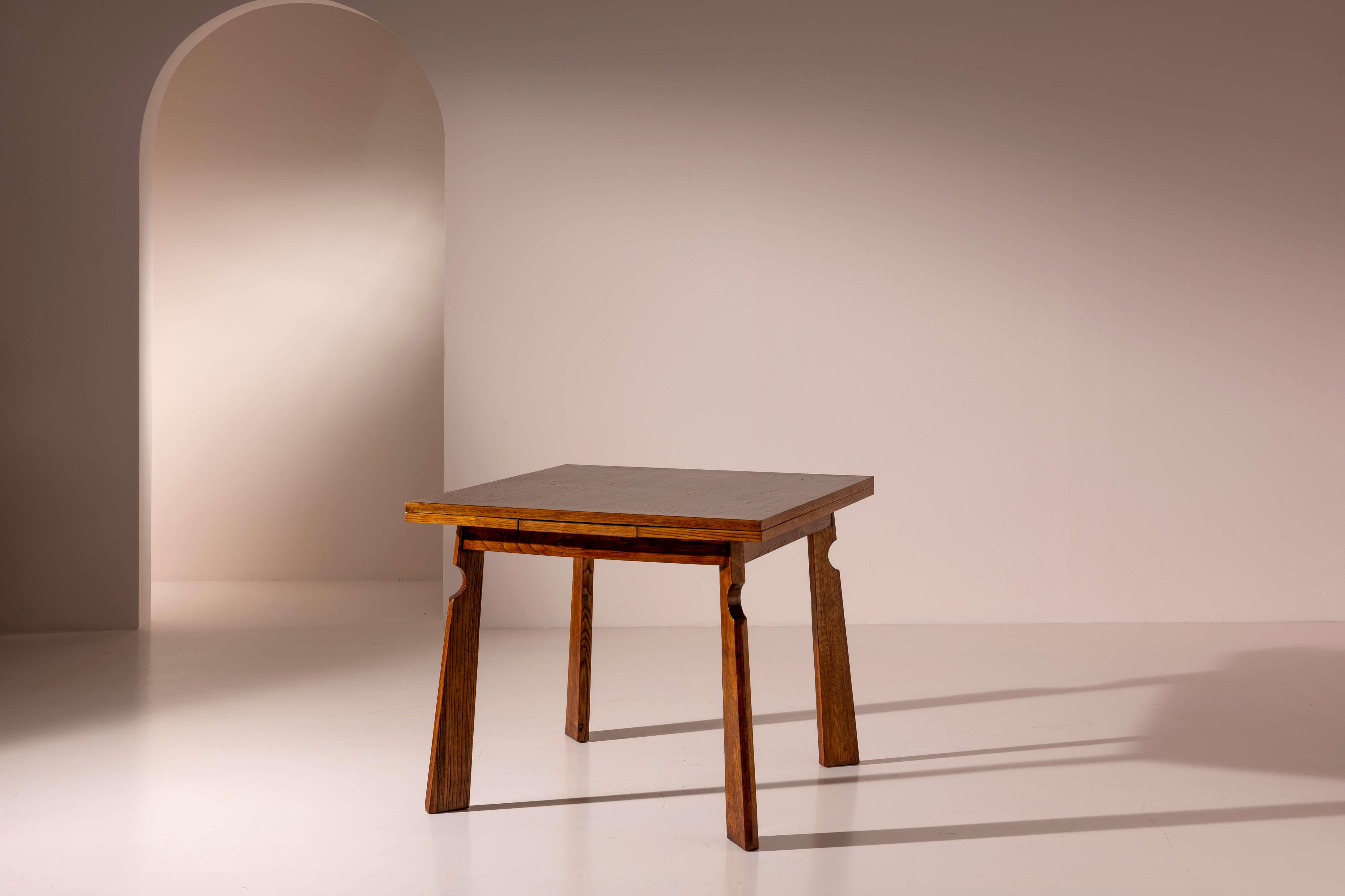 Square wooden dining table with pull-out extensions, attributed to Paolo Buffa, Italian manufacture, 1940s.

Paolo Buffa was a designer who reinvented traditional furniture forms, giving them a new, distinctive, and immediately recognizable
