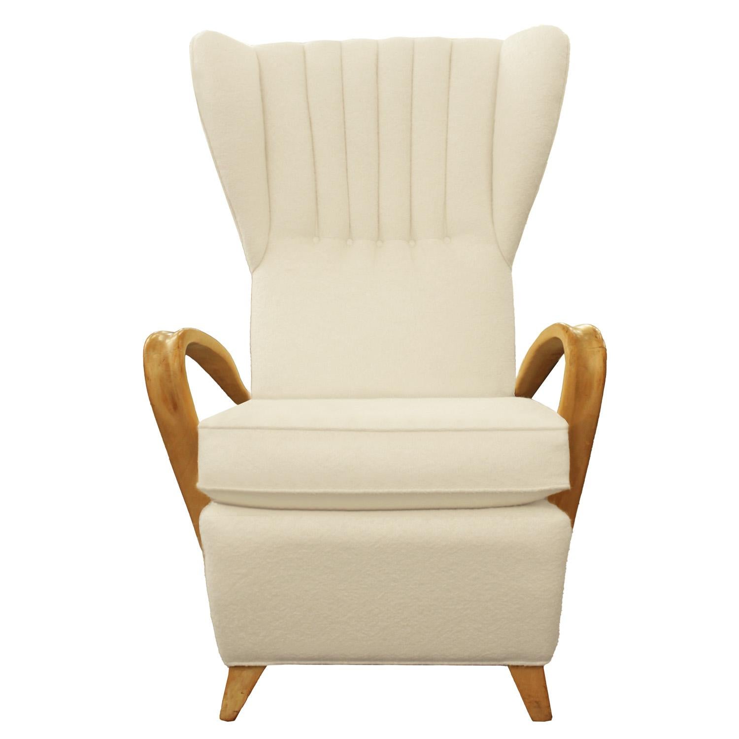 Tall, oversized wingback chair with open arm and wedge feet. Newly upholstered in off white Holly Hunt Geo Mohair with channel detail on seat back. Design attributed to Paolo Buffa. Italy, 1950s.