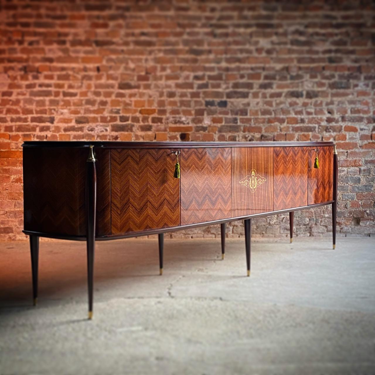 Paolo Buffa attributed rosewood credenza sideboard, Italy, circa 1945

Magnificent midcentury Italian Paolo Buffa attributed rosewood credenza Italy circa 1945, the long and elegant shaped top featuring inlaid light green veined onyx style glass,