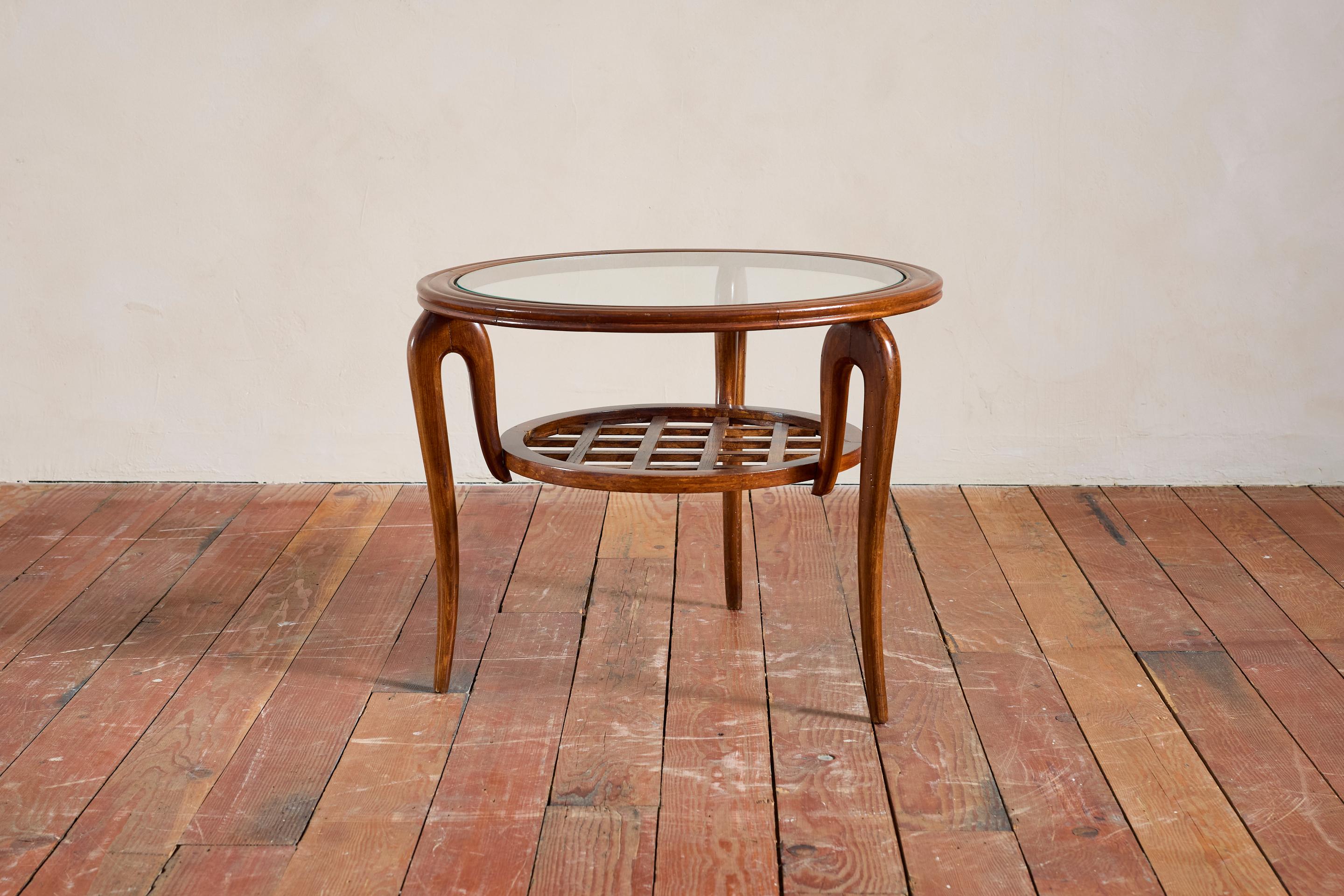 Elegant side table attributed to Paolo Buffa - Italy, circa 1940s 
Constructed of walnut wood with woven wooden shelf, graceful curved legs and glass inlayed top. 
Inverted loop detail where legs meet the top - wonderful detail 
