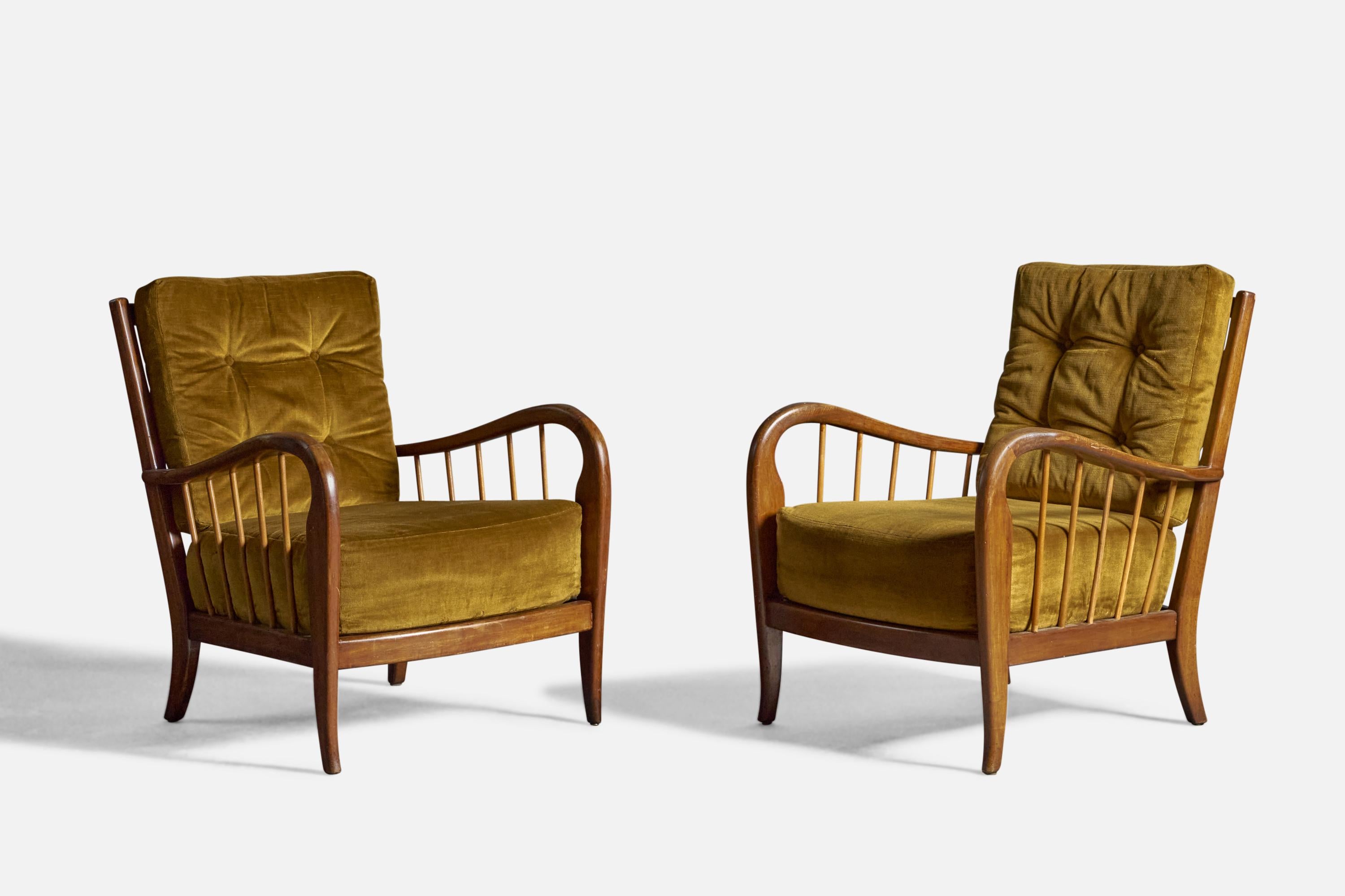 A pair of walnut and green velvet lounge chairs, designed and production attributed to Paolo Buffa, Italy, c. 1940s.
