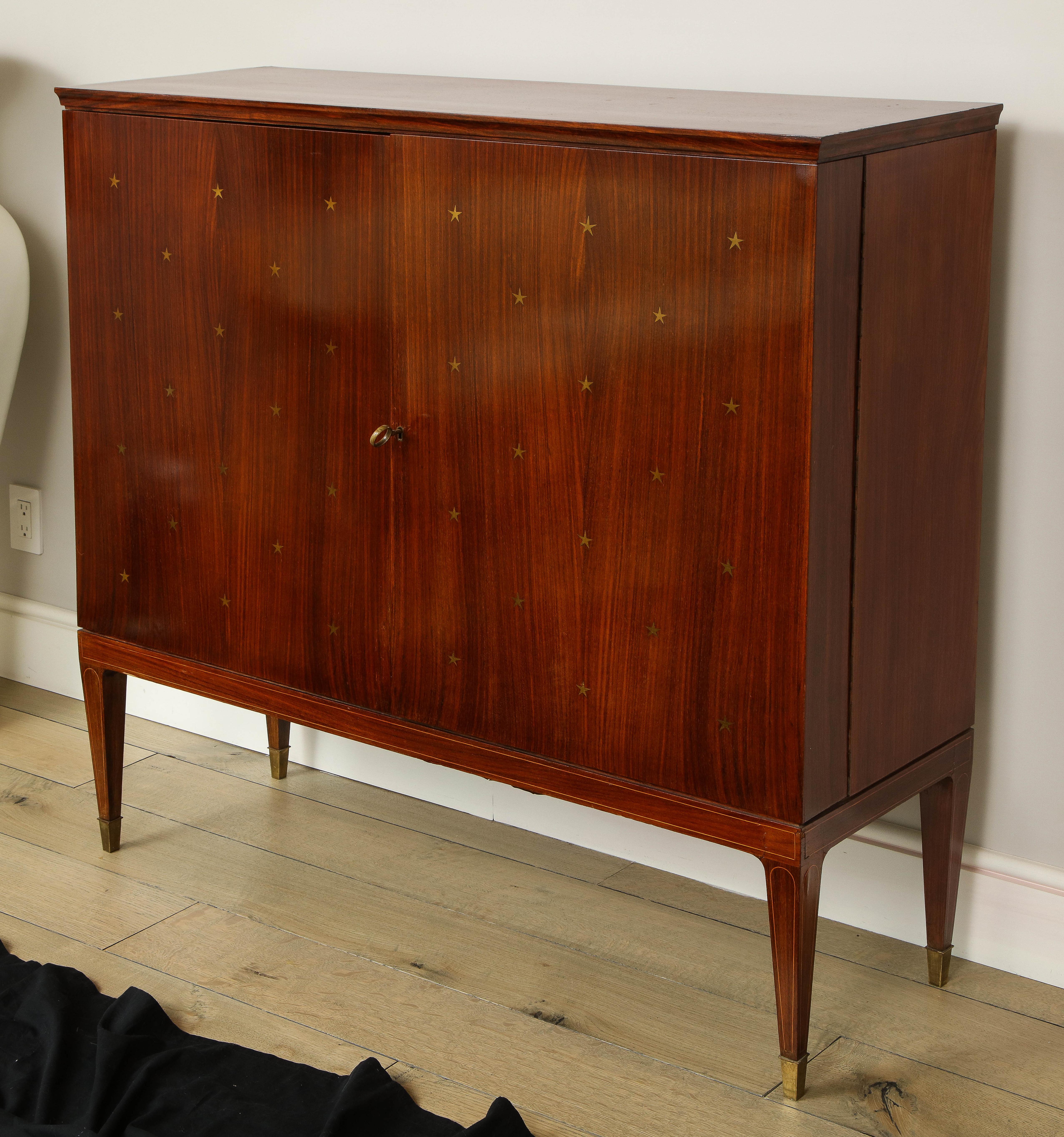 Paolo Buffa bar cabinet with gold star detailing.
Incredible cabinet in perfect condition. This is a rare piece and not many of this model were made.


  