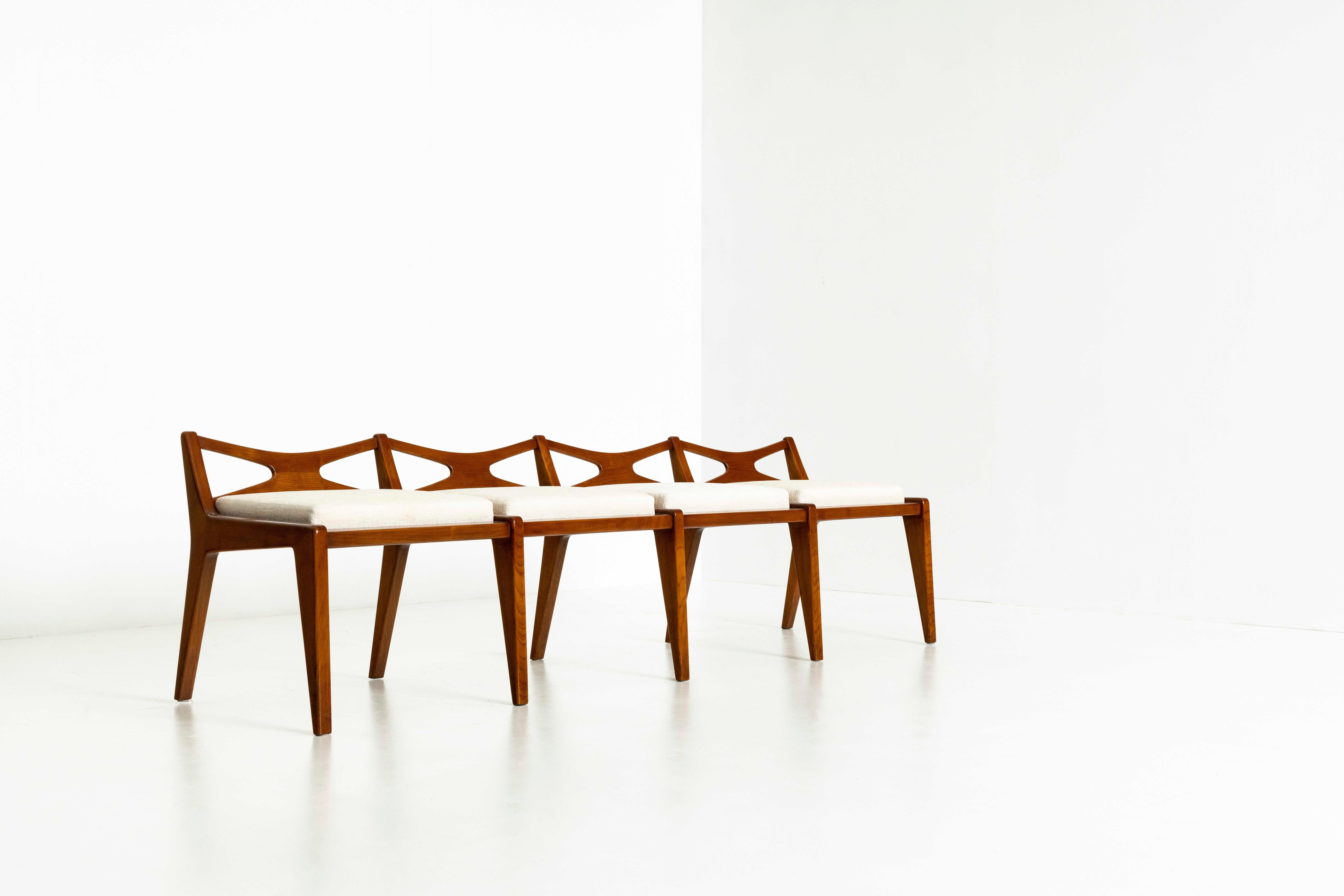 Unique Paolo Buffa bench in walnut and fabric from Italy, the 1950s. The combination of the warm wood color, the beautiful shapes, and the fabric makes this very attractive. Especially the design of the backrests and the legs is very elegant. The