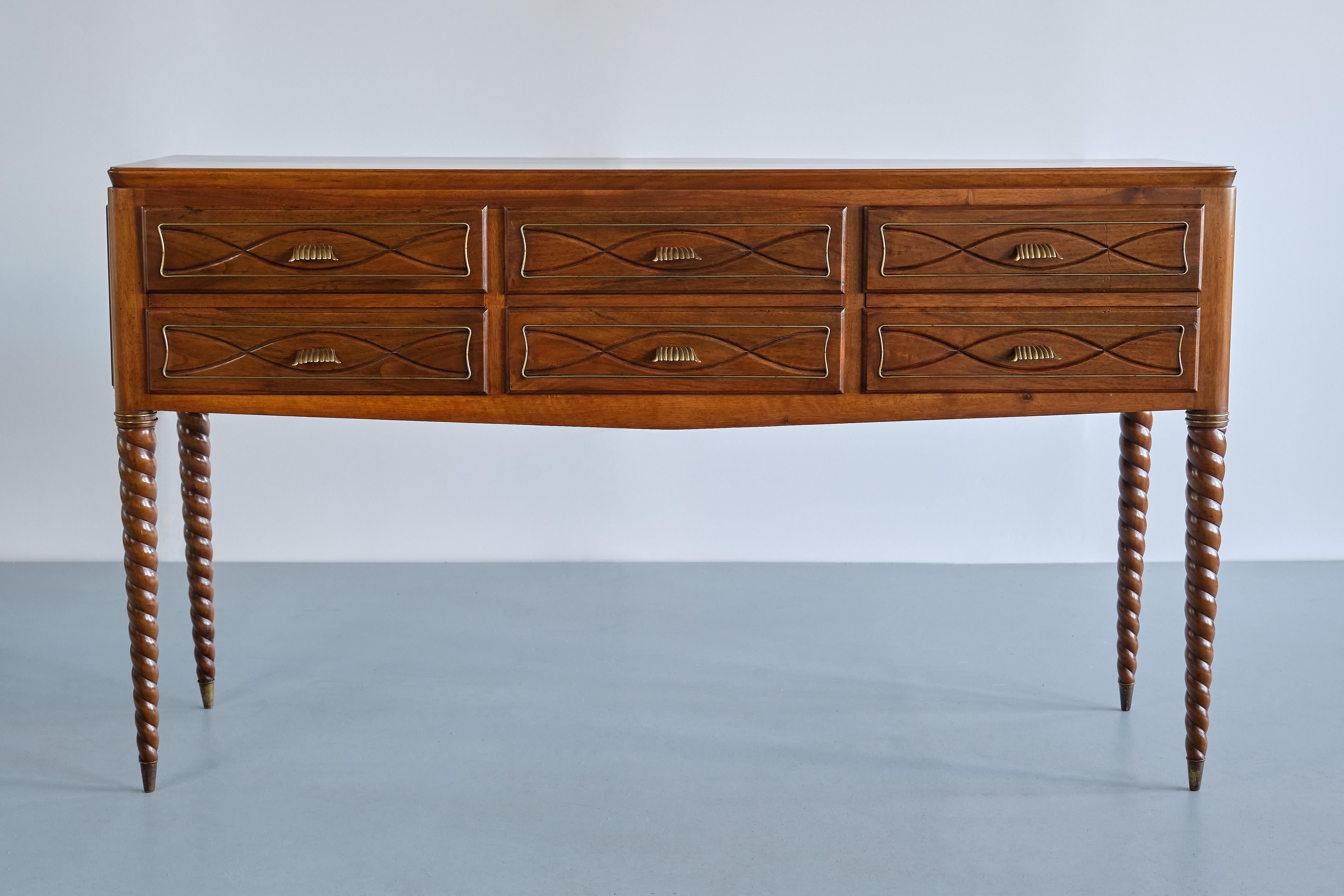 This exceptional counter-buffet / sideboard was designed by Paolo Buffa and produced by Mario Quarti in Milan, Italy, in the 1940s. 
The sideboard stands on four grooved, turned twist legs in solid walnut with brass tips and upper brass ring