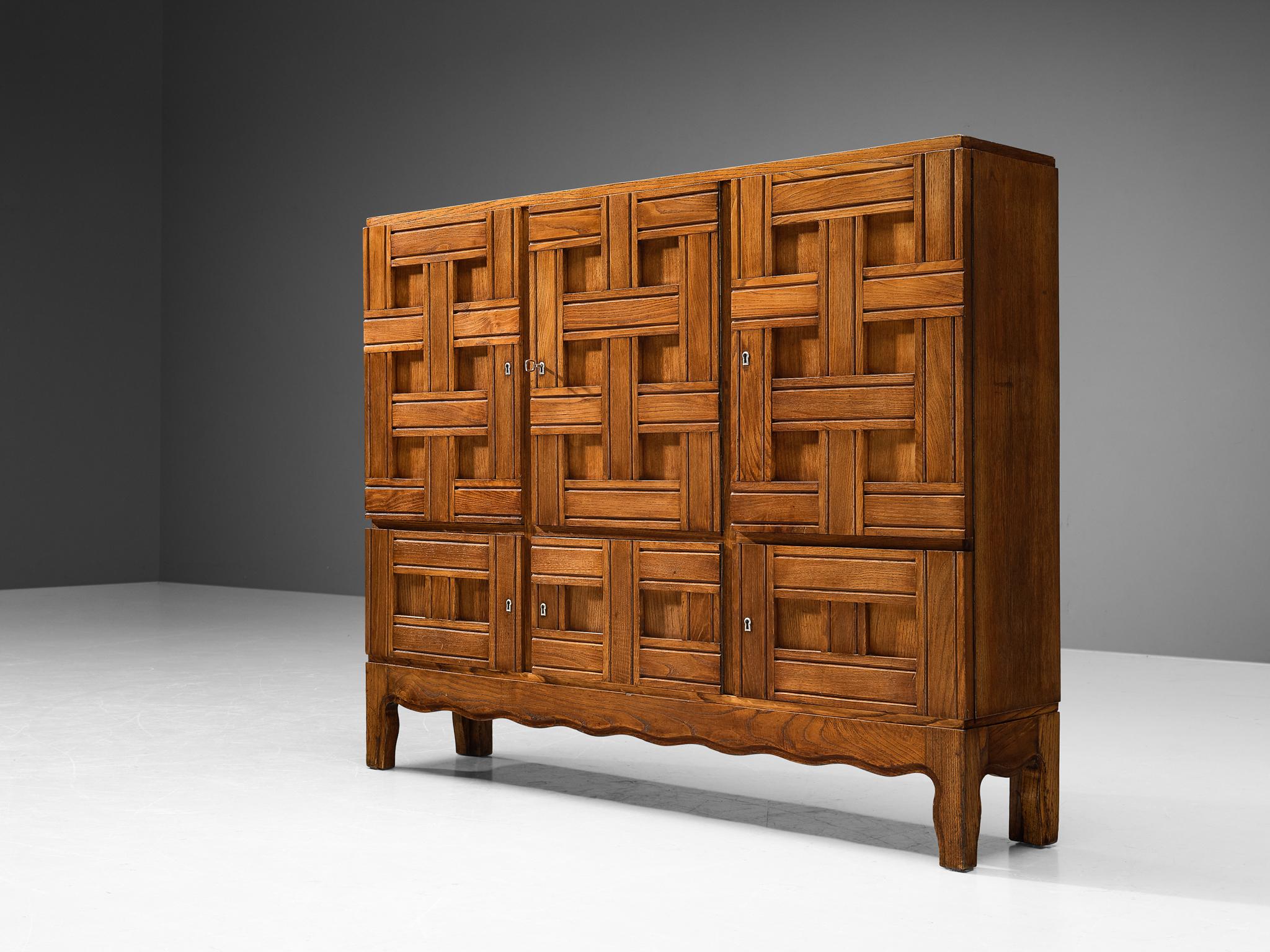 Paolo Buffa, cabinet, chestnut, Italy, 1940s.

This rare cabinet has a subtle decorative character and is created by the talented Italian designer and architect Paolo Buffa (1903-1970). The front of this wonderful piece features an artistic