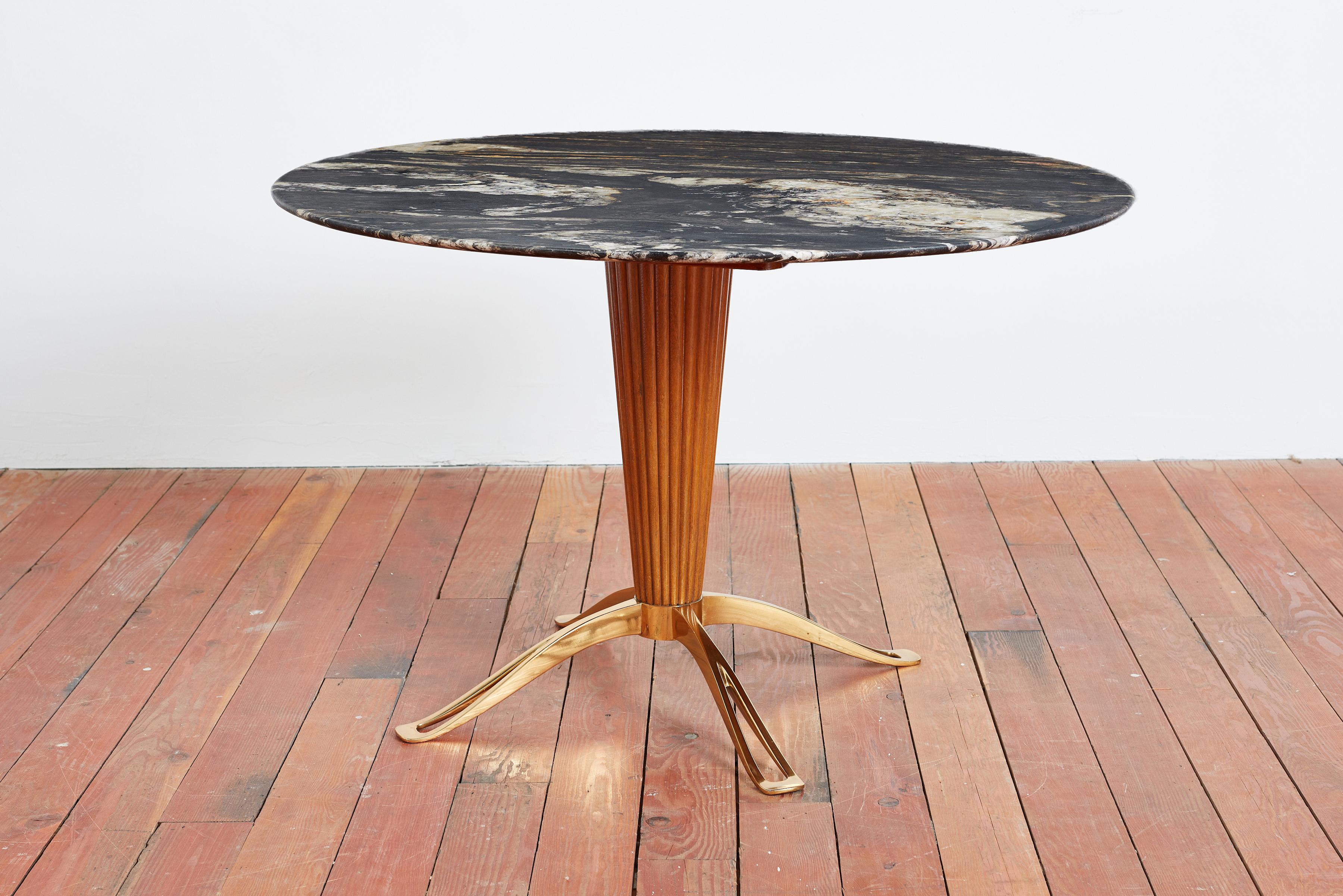 Incredible table by Paolo Buffa - Italy, 1950s
Sculptural solid brass base with fluted walnut wood and gorgeous black marble top. 