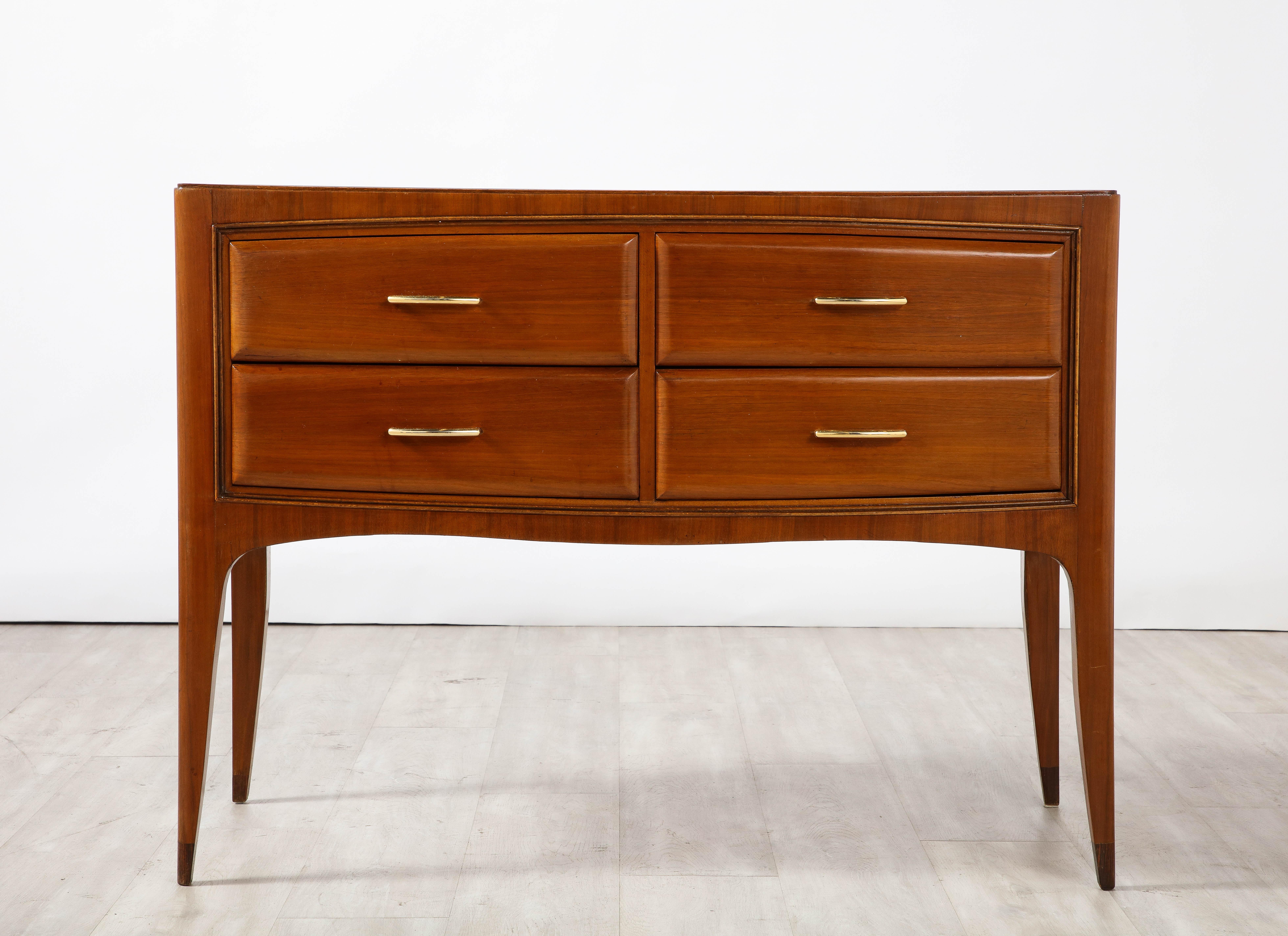 A fine and elegant chest of drawers or commode by Paolo Buffa, circa 1940.  The handsome mahogany case is perfectly proportioned with four horizontal drawers, all with a slight curve with elegant brass horizontal handles which mimic the drawer