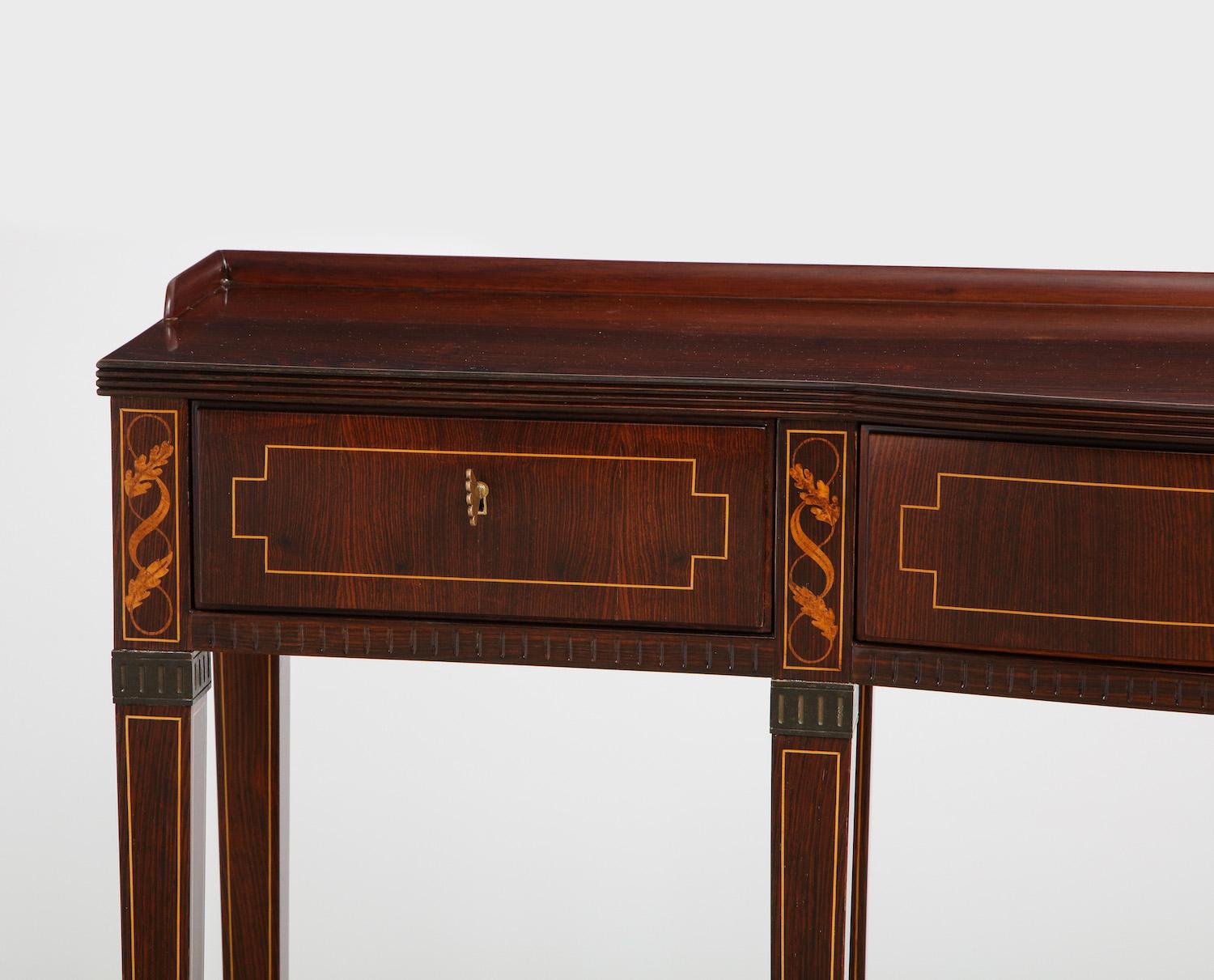 8-legged console table by Paolo Buffa. Rosewood, maple, burled maple, walnut, brass. Elegant console table with 3 drawers, foliage inlays and brass feet and mounts. Each drawer opens with a stylized brass key with a design that is typical of Paolo