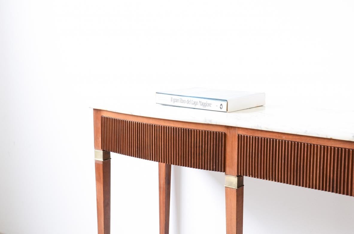 COD-2829
Paolo Buffa (1903-1970)

Splendid console table with wavy line front, three drawers in reeded wood on the front and sides with a top in bardiglio marble and six long legs with capitals and brass tips.

Manufactured by Dassi Turin, ca.1950.