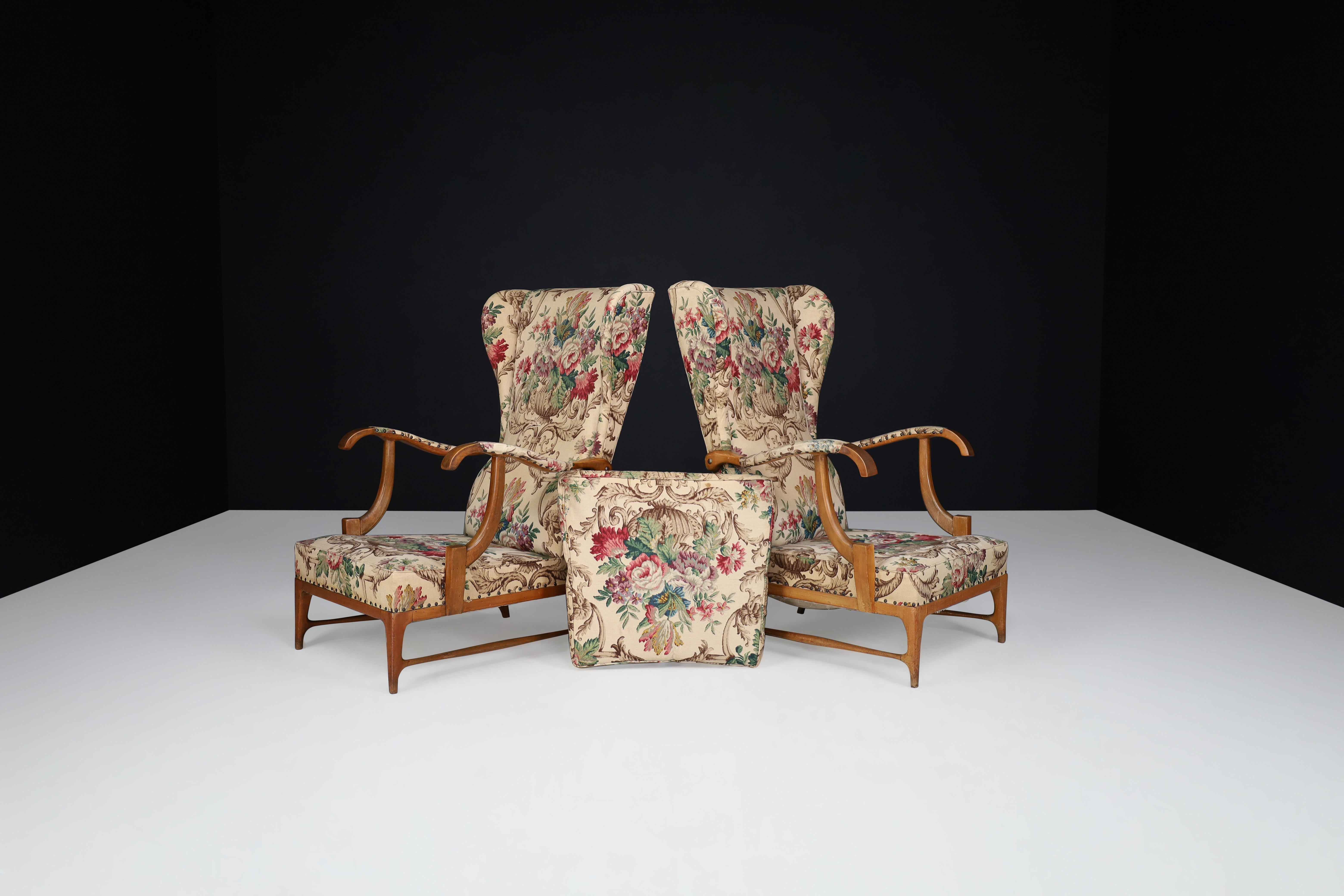 Paolo Buffa high-back armchairs with floral upholstery, Italy, 1940s

Paolo Buffa high-back armchairs with floral upholstery, Italy, 1940s. These armchairs are featured with the original floral fabric and have lovely Italian walnut wood details.