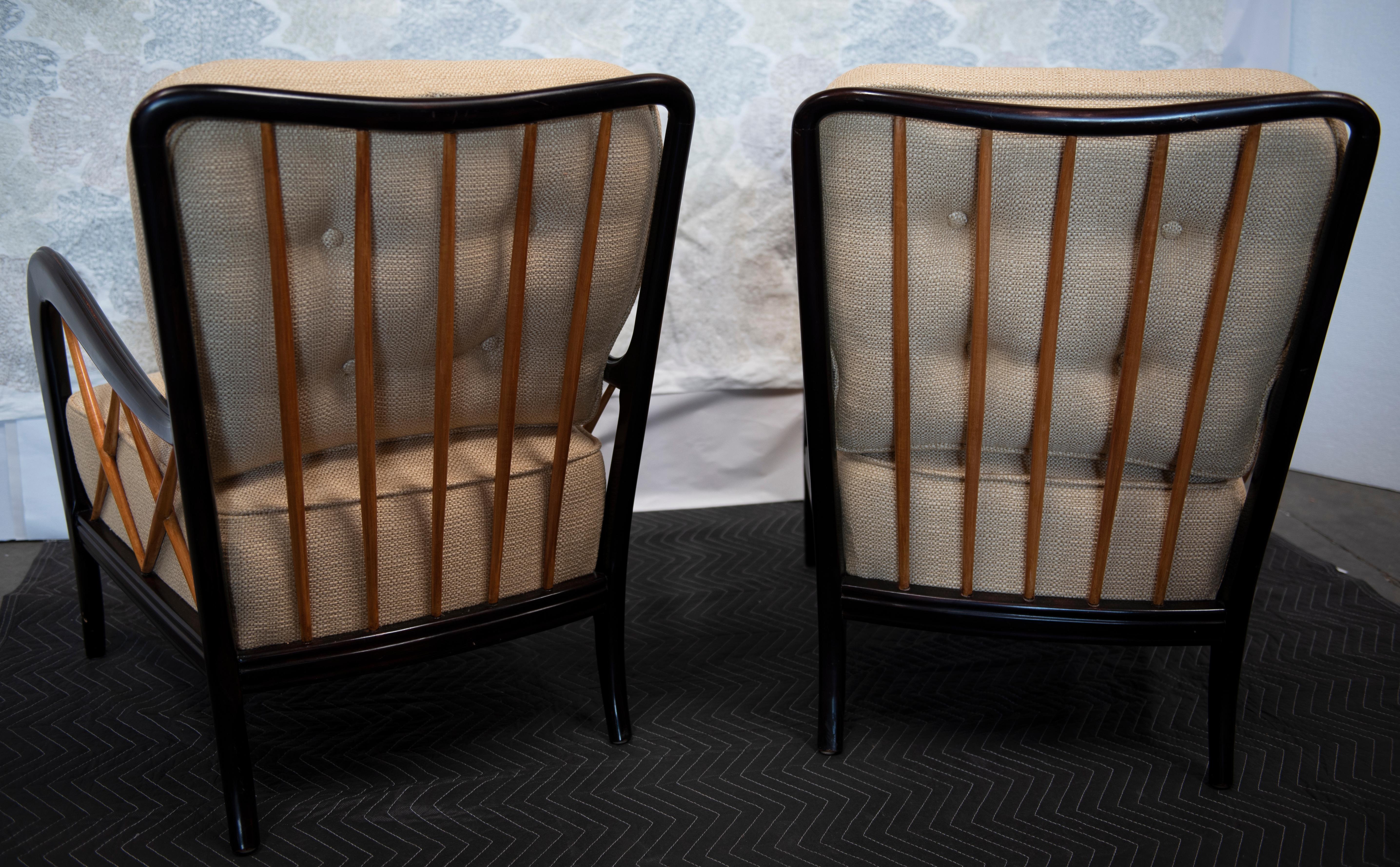 A pair of Italian 1940s eboniezed armchairs with natural ash cross-hatches supports removable upholstered cushions, circa 1940. Believed to be attributed to Guglielmo Ulrich and Paolo Buffa. Each chair with incurved, rectangular, vertically slatted