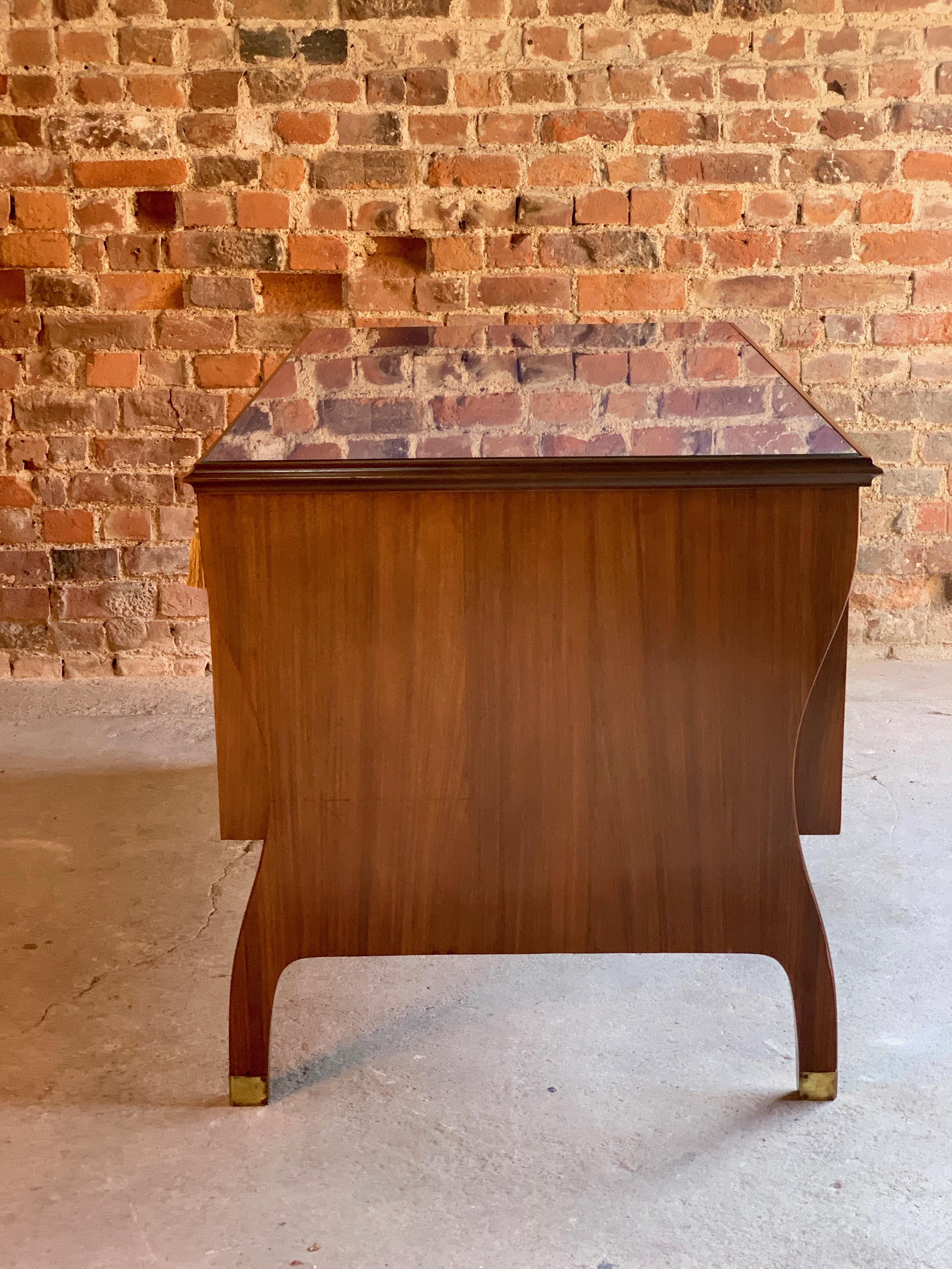 Paolo Buffa Kingwood Parquetry Kneehole desk, Italy, circa 1940??

This exceptional Paolo Buffa Kingwood Parquetry desk dates to Italy, circa 1940s, the rectangular blue baize top, covered with glass, over six parquetry herringbone drawers each