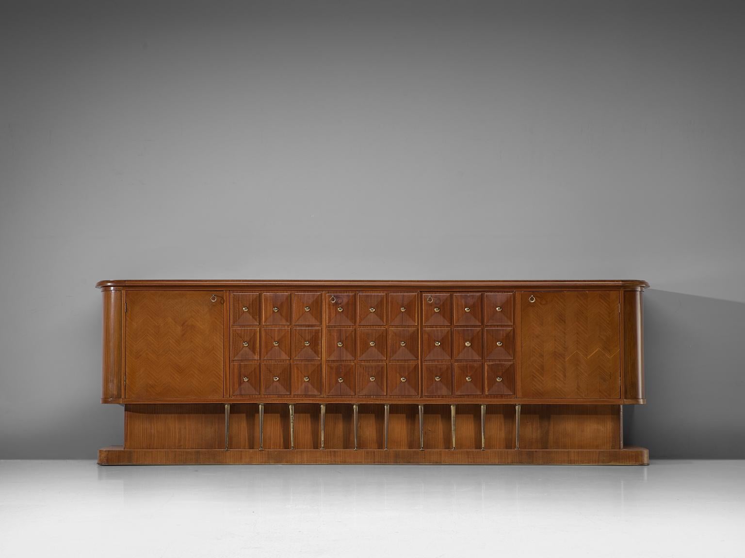 Paolo Buffa, sideboard, walnut and brass, Italy, 1940s.

This stunning sideboard by Paolo Buffa needs a new home, that has the space for it. 
It consists of five doors, that offer plenty of storage space. Two doors have a fish bone pattern inlay.